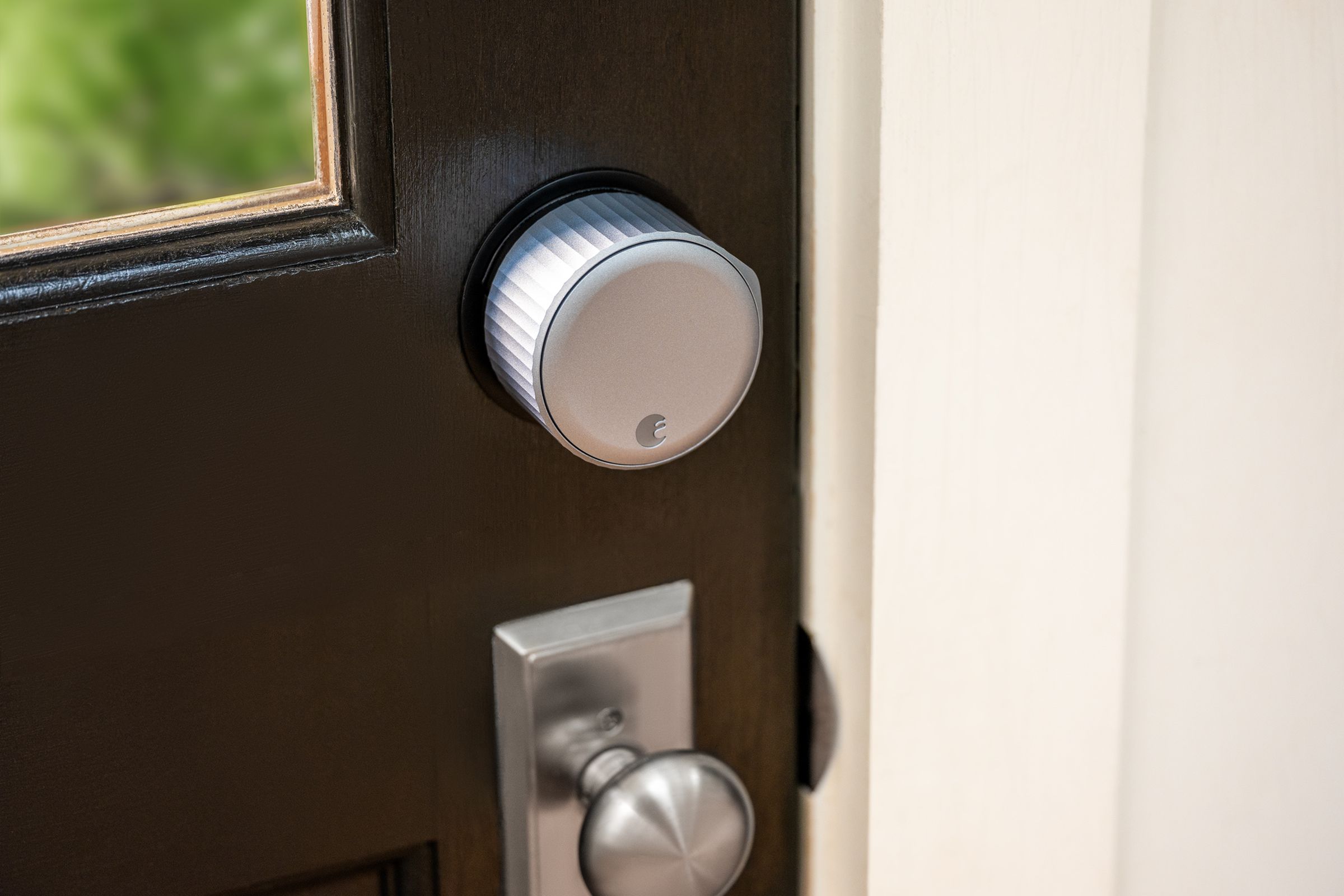 August Wi-Fi Smart Lock installed on a brown door