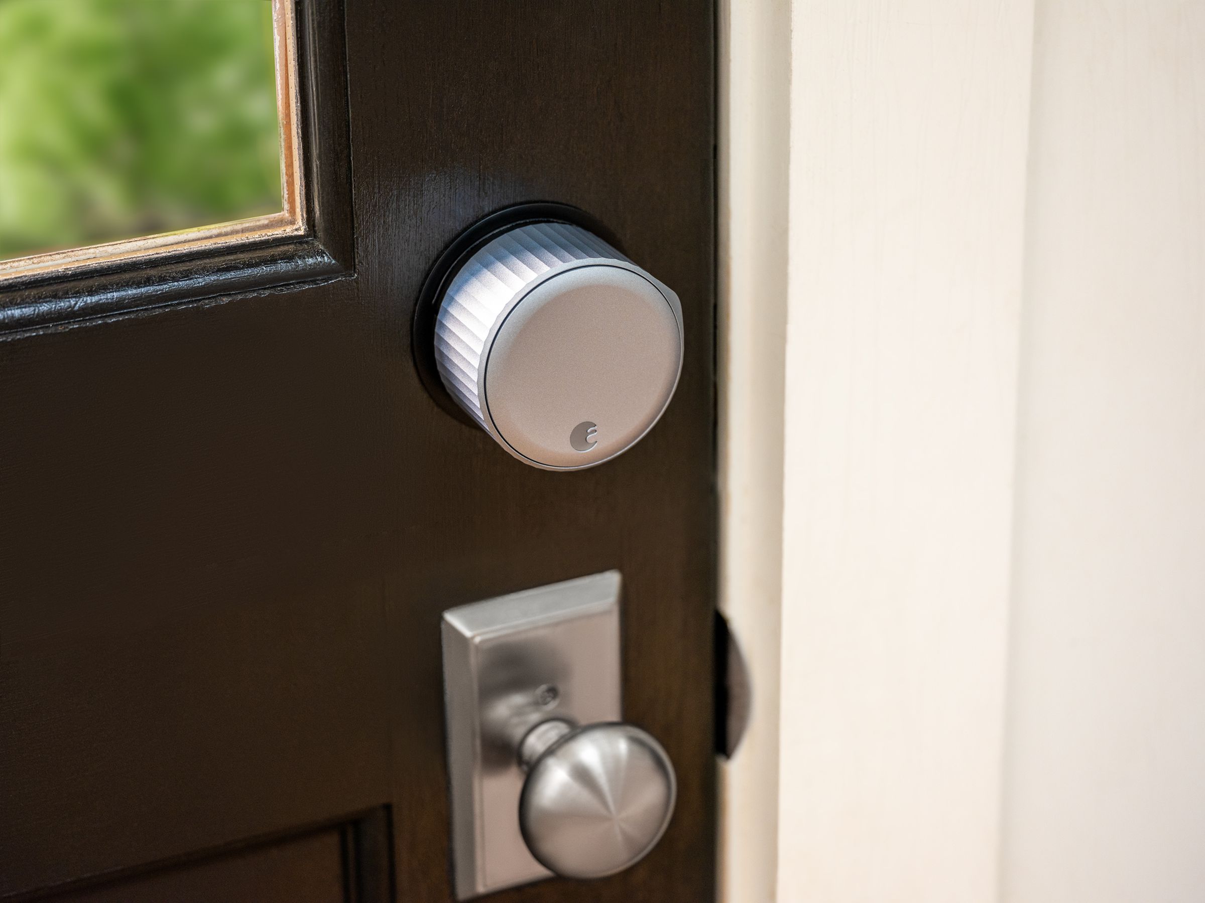 August Wi-Fi Smart Lock installed on a brown door
