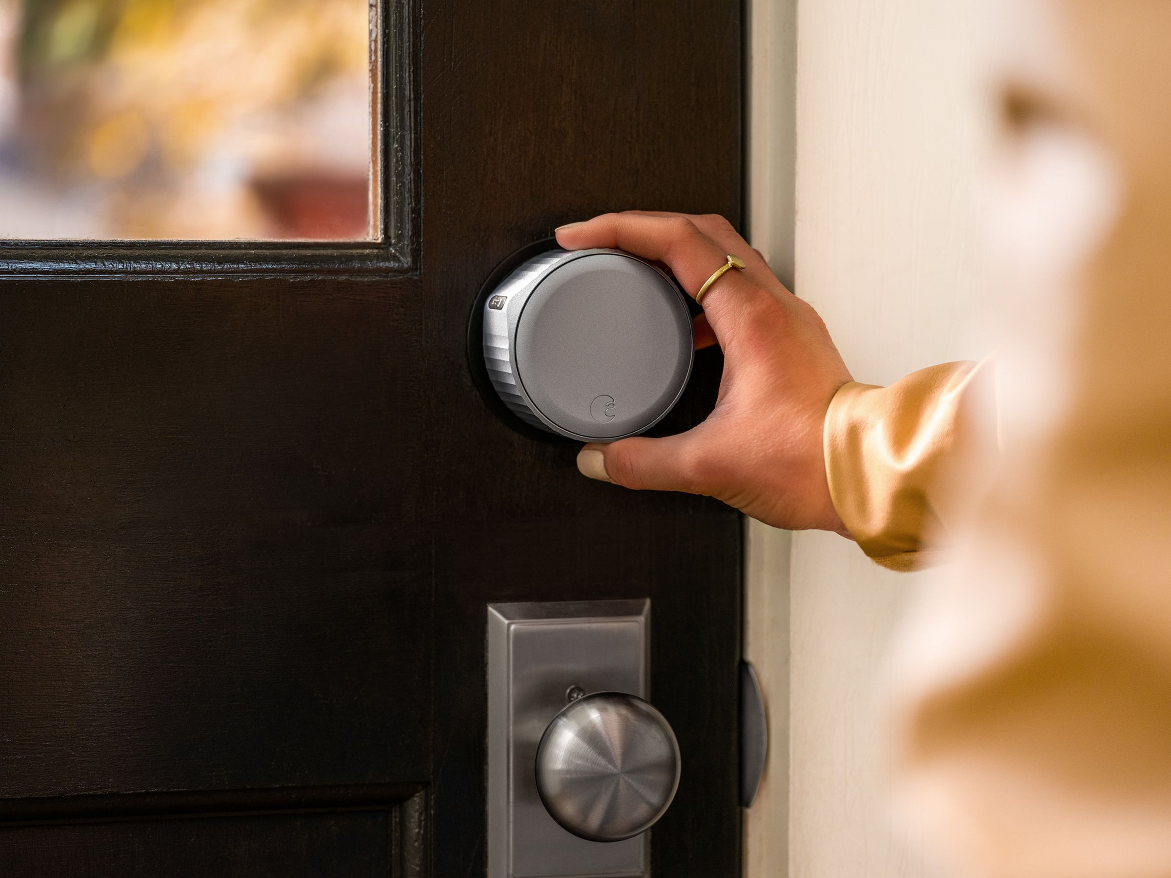 An August Wi-Fi Smart Lock being used to lock the door.