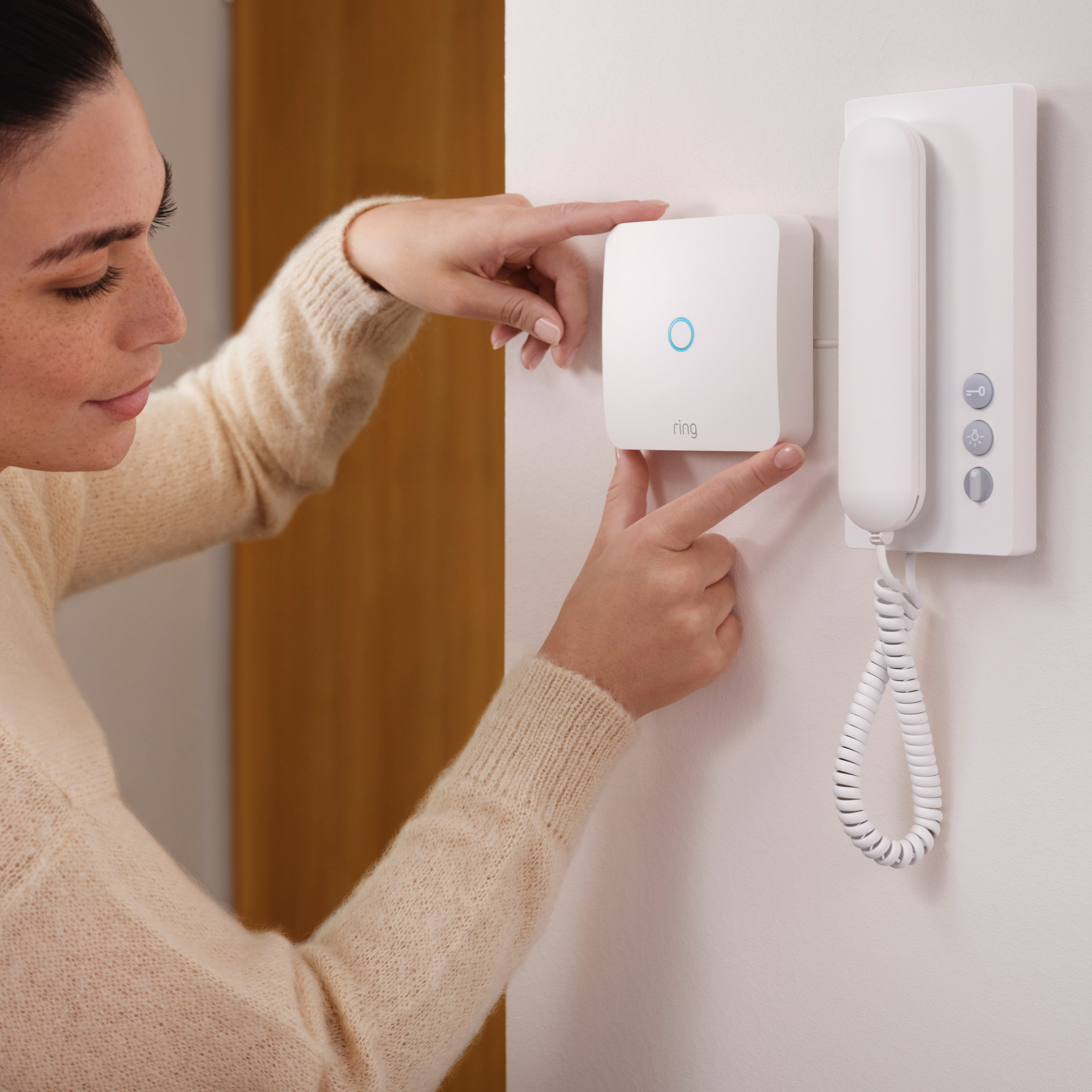 Ring Intercom installs next to your apartment's intercom handset and is battery-powered.