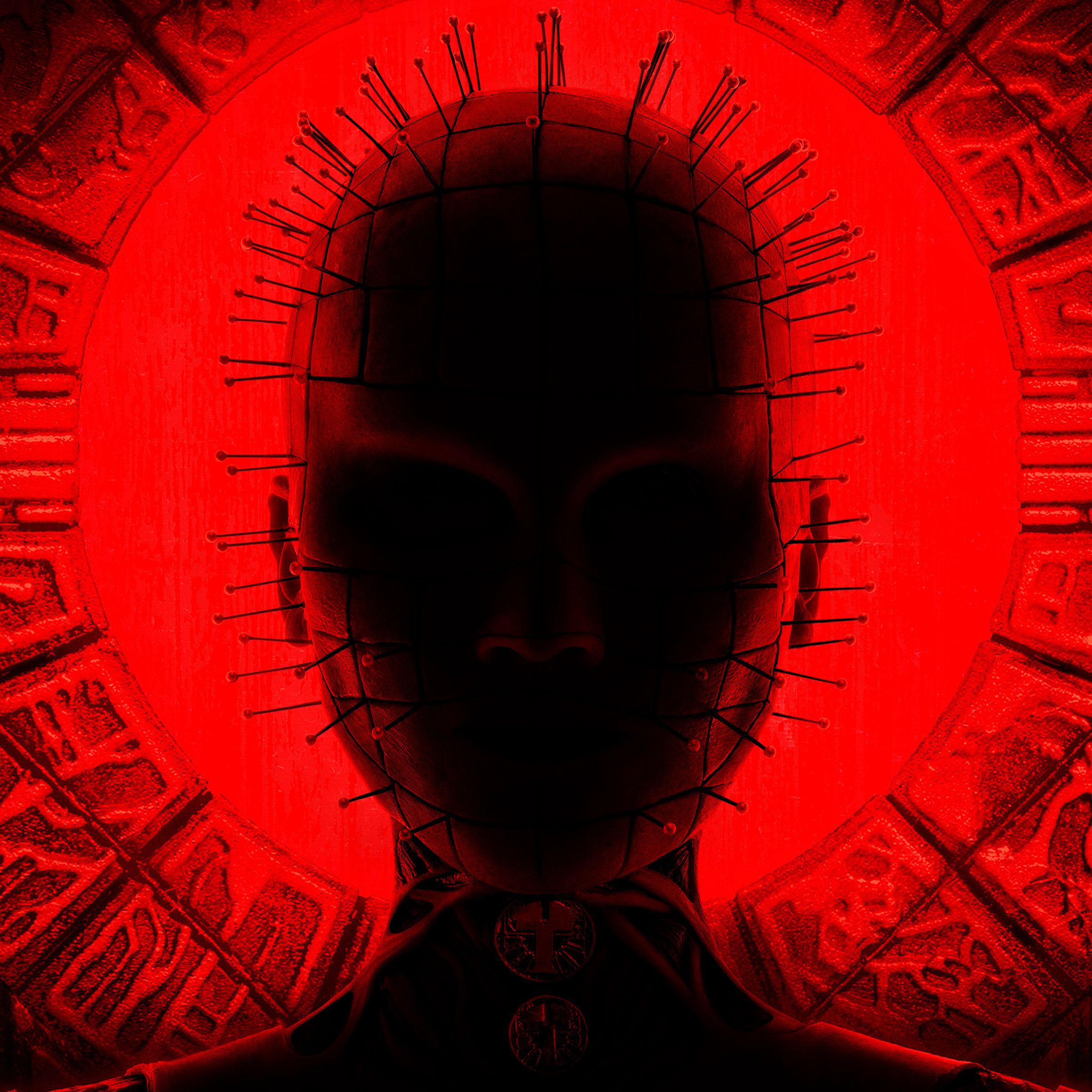 A close-up shot of a bald woman who is cast in shadow but backlit by a red glow that highlights the dozens of thin two-inch-long needles protruding from every part of her face and a pair of circular objects dangling from her throat.