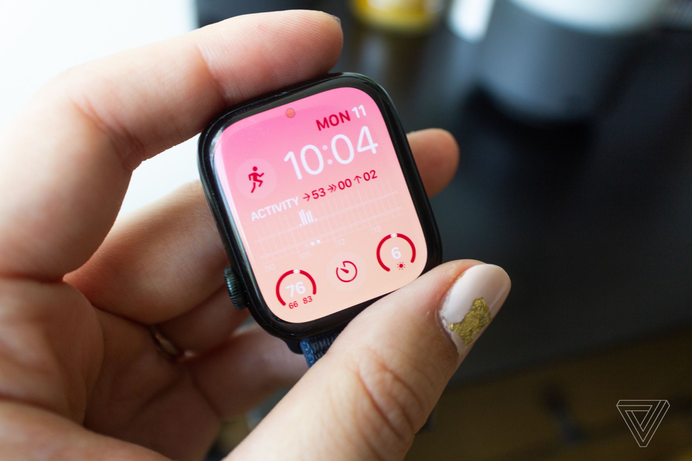 A pink color gradient version of the Modular Apple Watch face on a Series 7