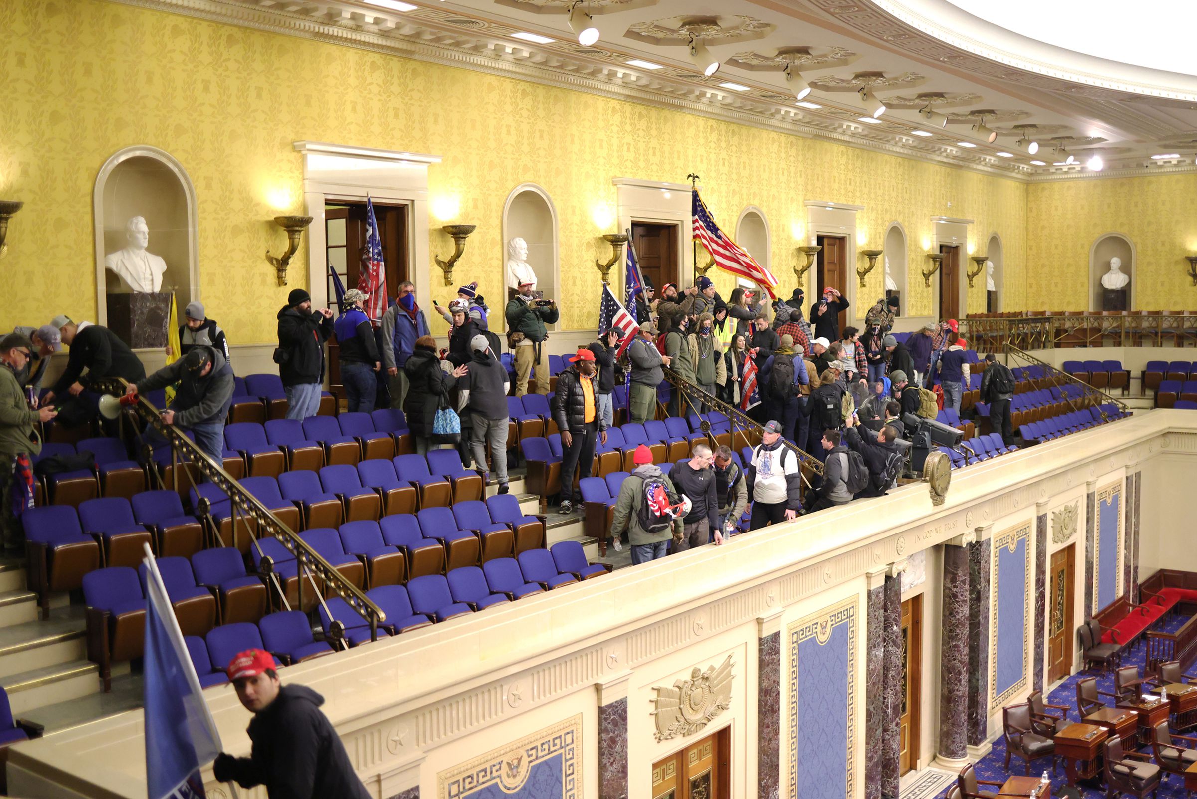Protesters enter the Senate Chamber.