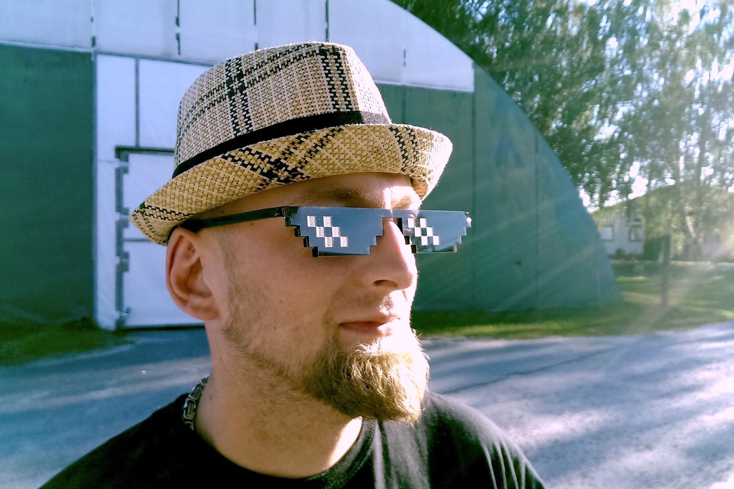 A man models the new 'Deal with It' sunglasses
