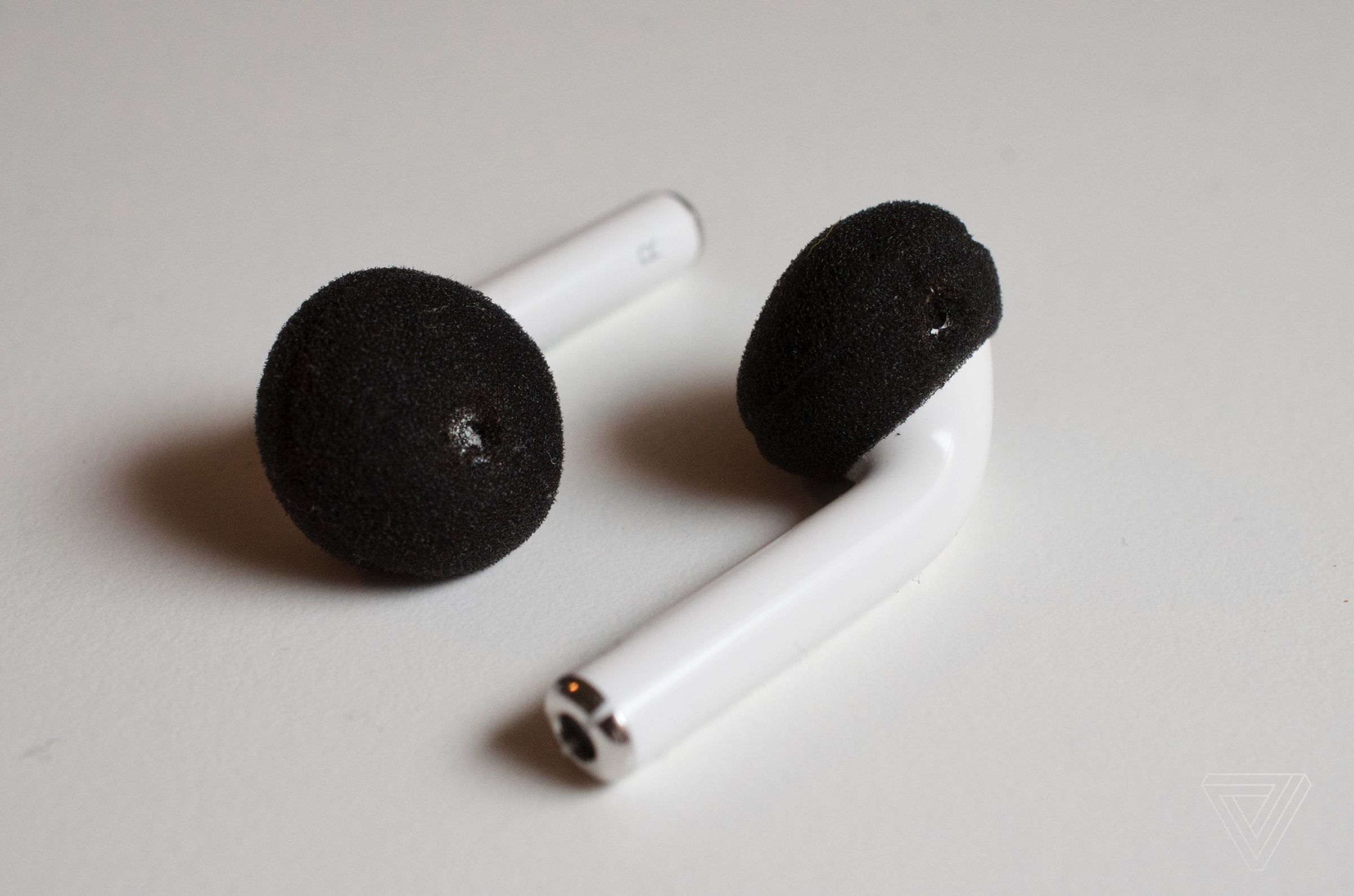 The AirPods after foam cover hack.