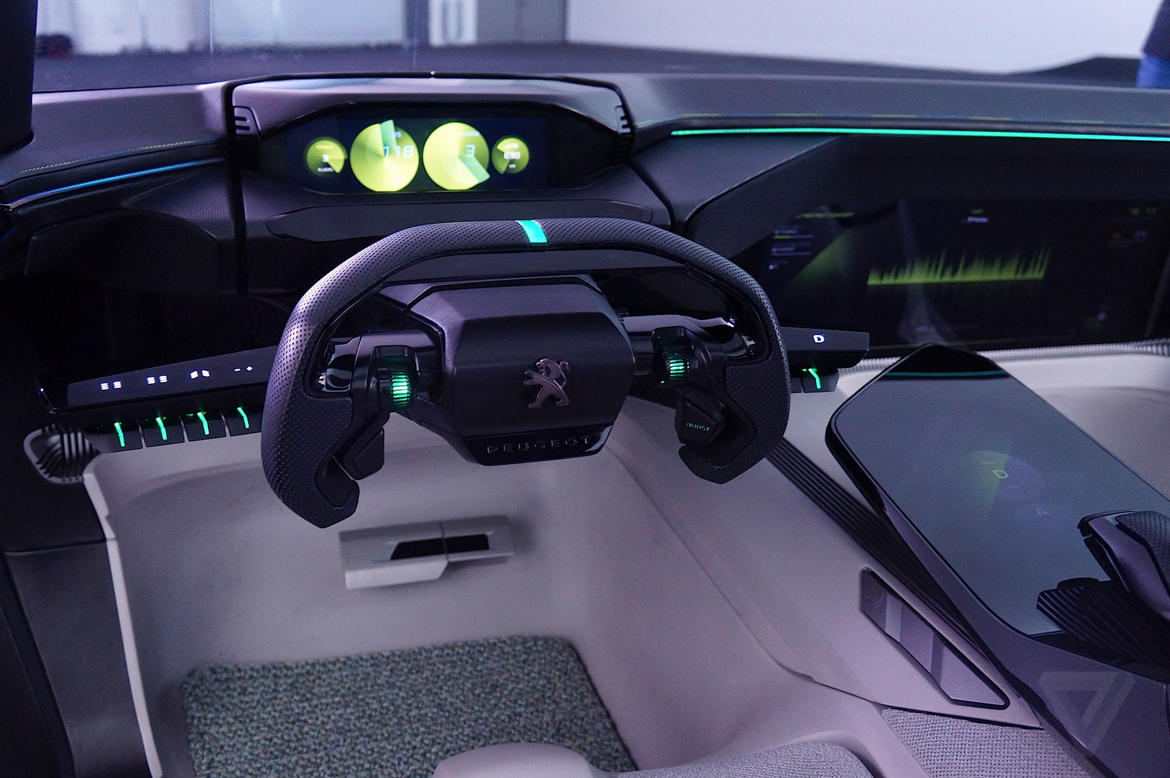 Peugeot has pared down its i-Cockpit interface for the Instinct, though it retains its retractable steering wheel and gas pedal. 