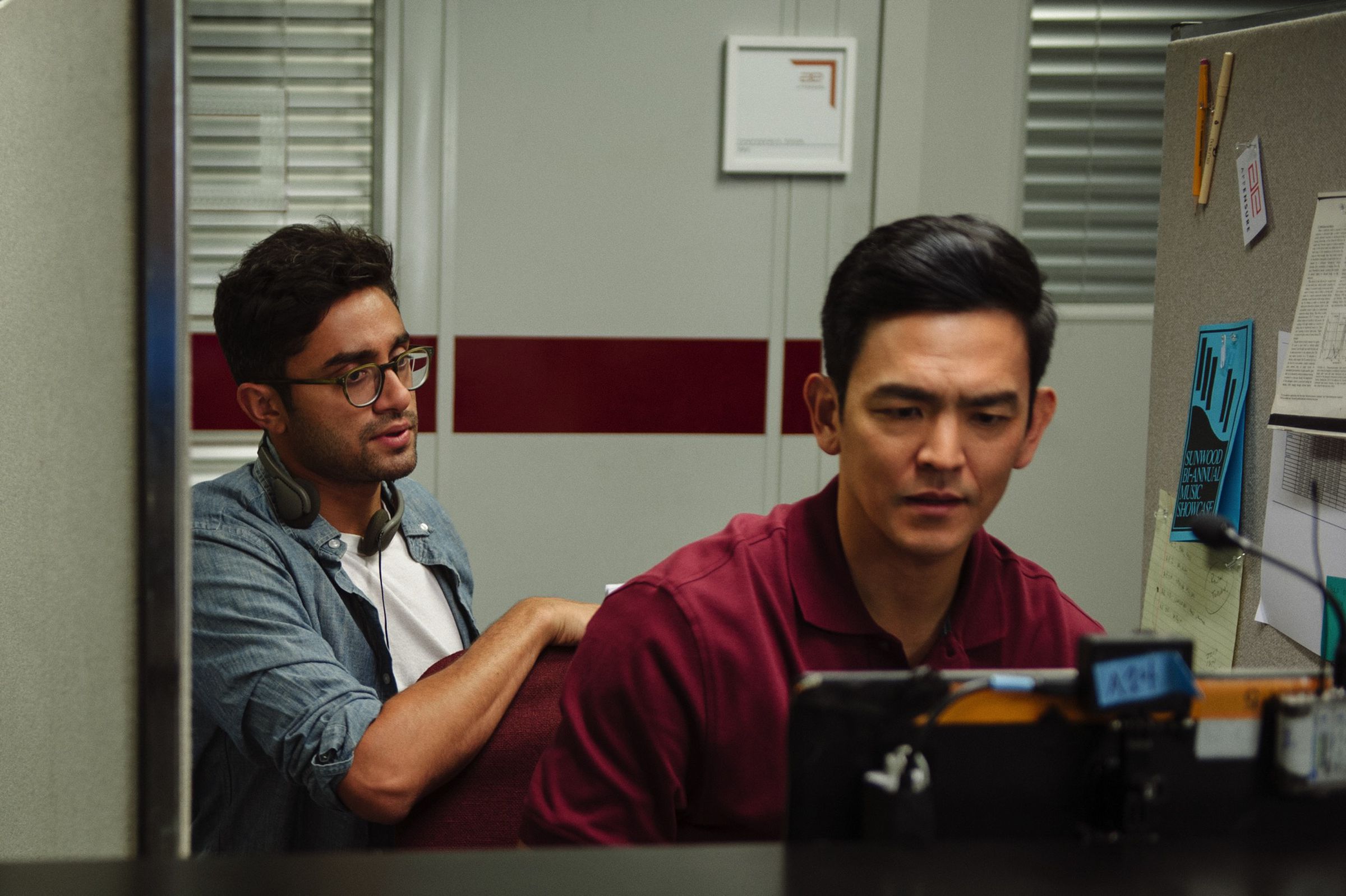 Director Aneesh Chaganty works with John Cho in front of the GoPro rig on set.