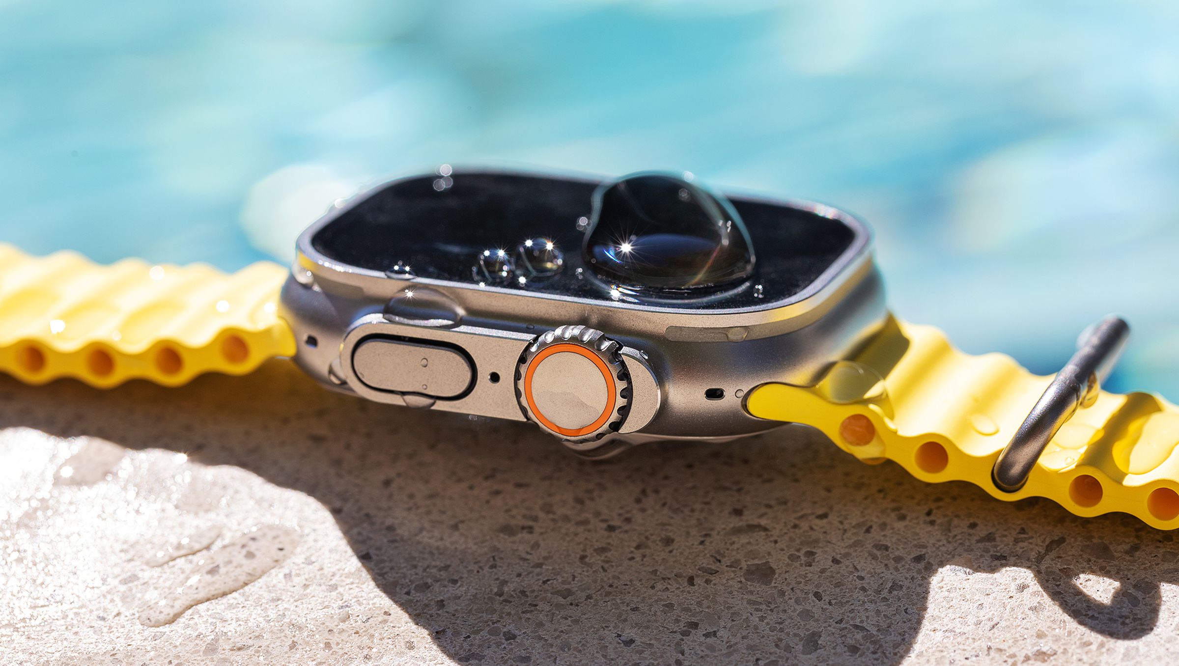Side view of Apple Watch with Ocean band by the pool