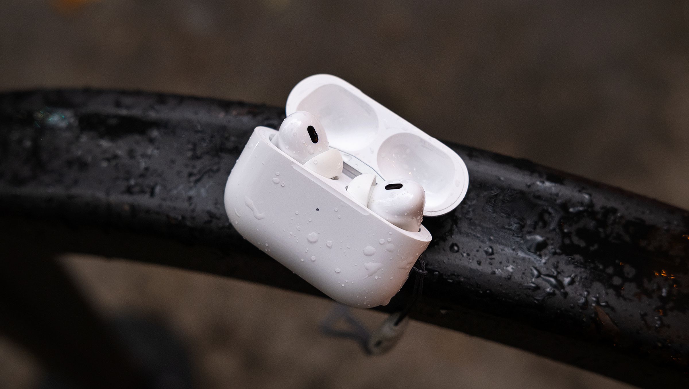 A pair of AirPods in an open charging case