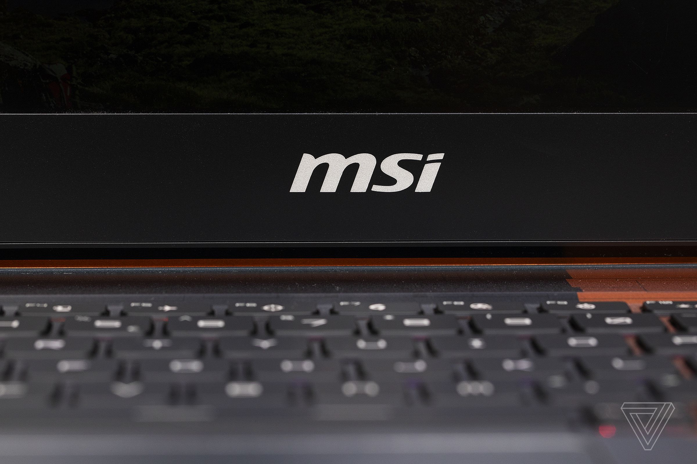 The MSI logo on the bottom bezel of the MSI GE66 Raider Dragonshield Edition.