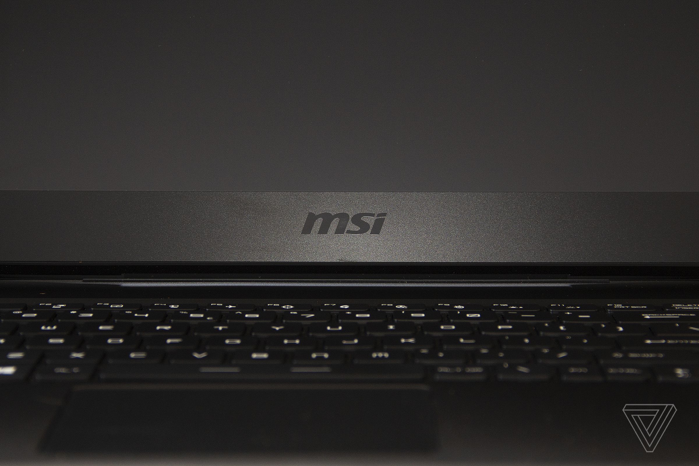 The MSI logo on the bottom bezel of the MSI GP66 Leopard display, seen close up.