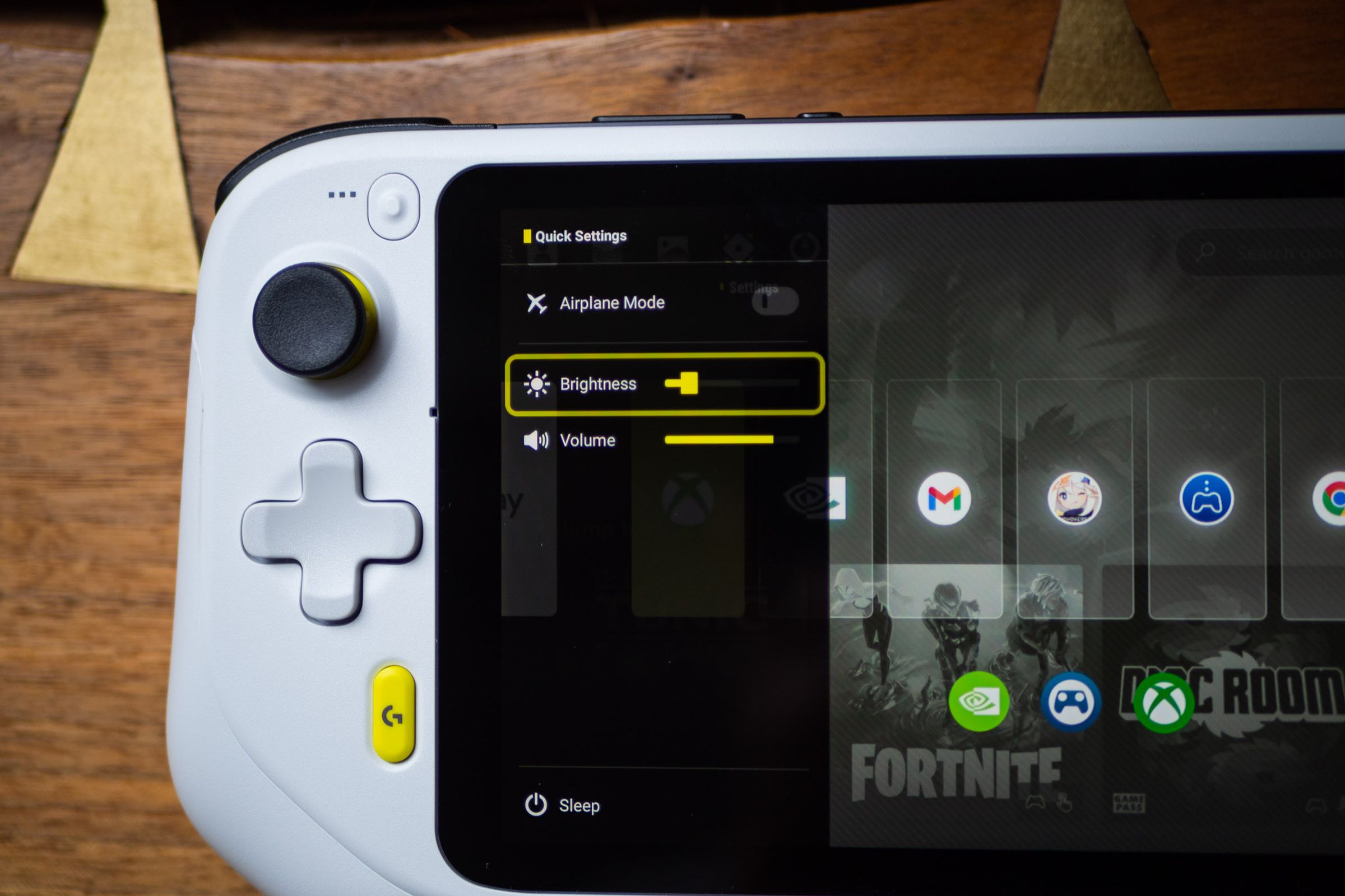 The Logitech G Cloud Gaming Handheld showing its quick settings screen, where the user can adjust the volume or brightness.