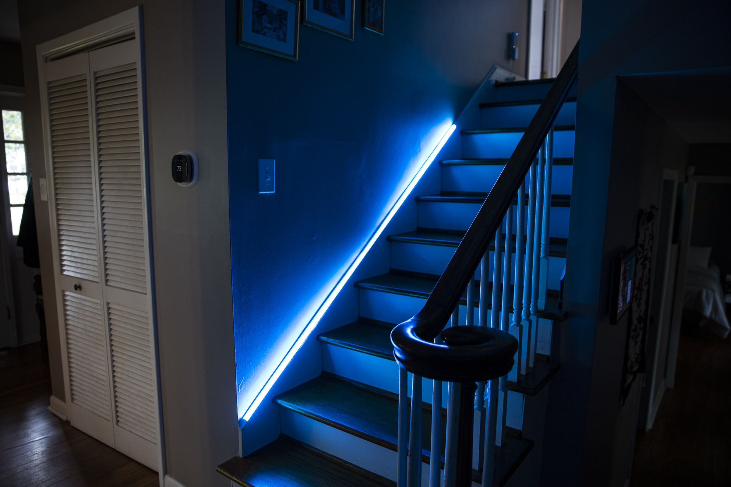 A blue LED light strip on a staircase.