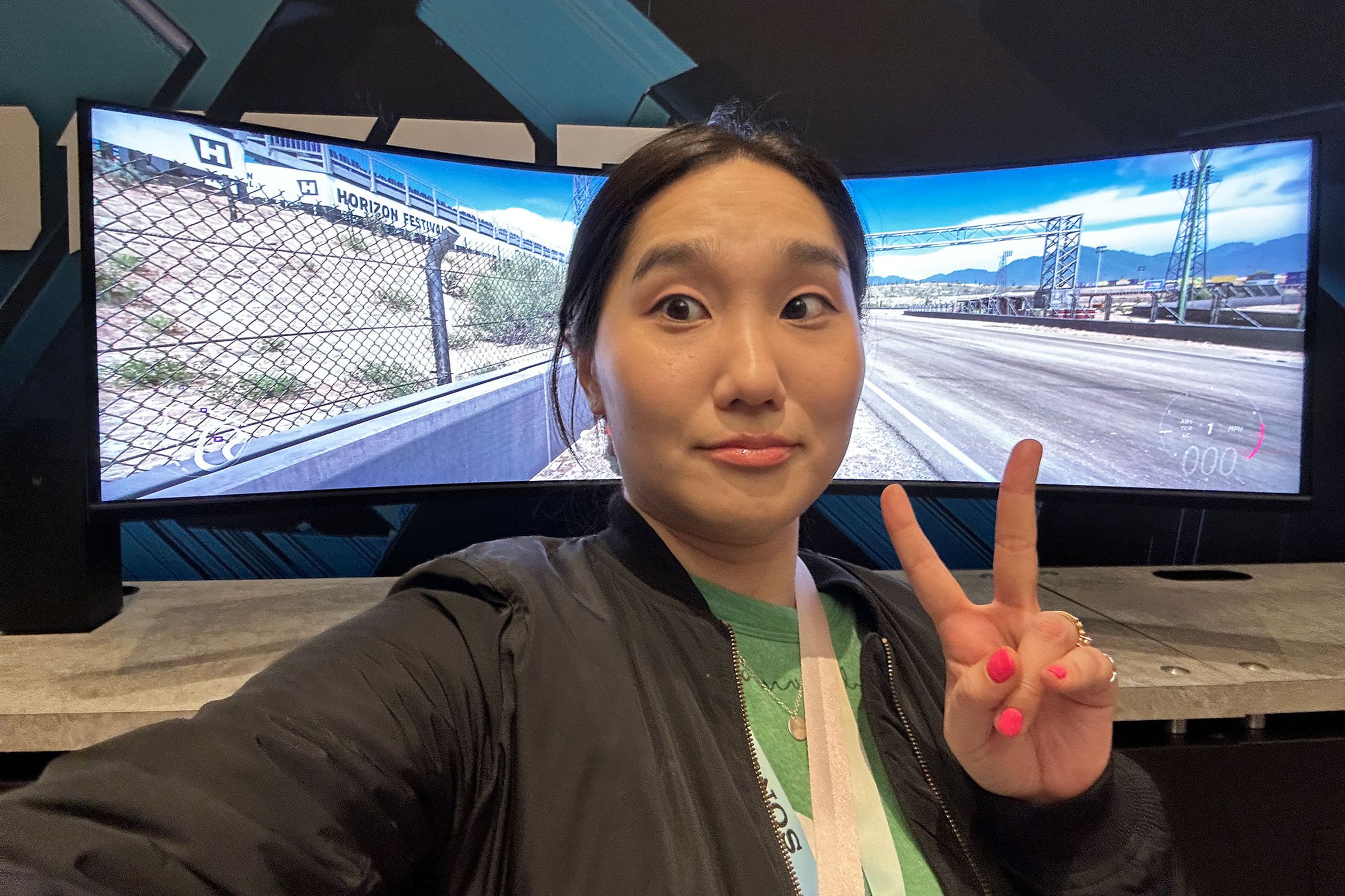Person taking selfie in front of Acer Predator Z57. 