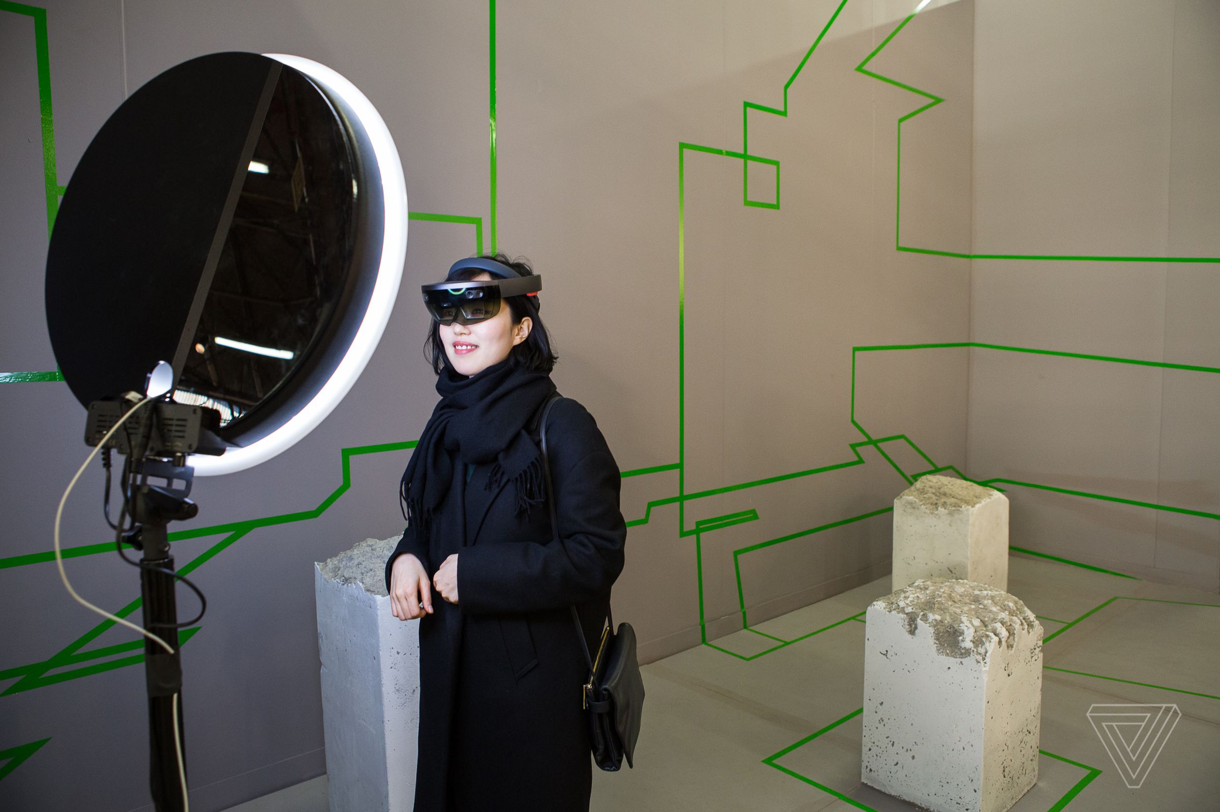 Visitors wear HoloLens VR glasses to view Studio Drift’s piece, <em>Concrete Storm.</em>