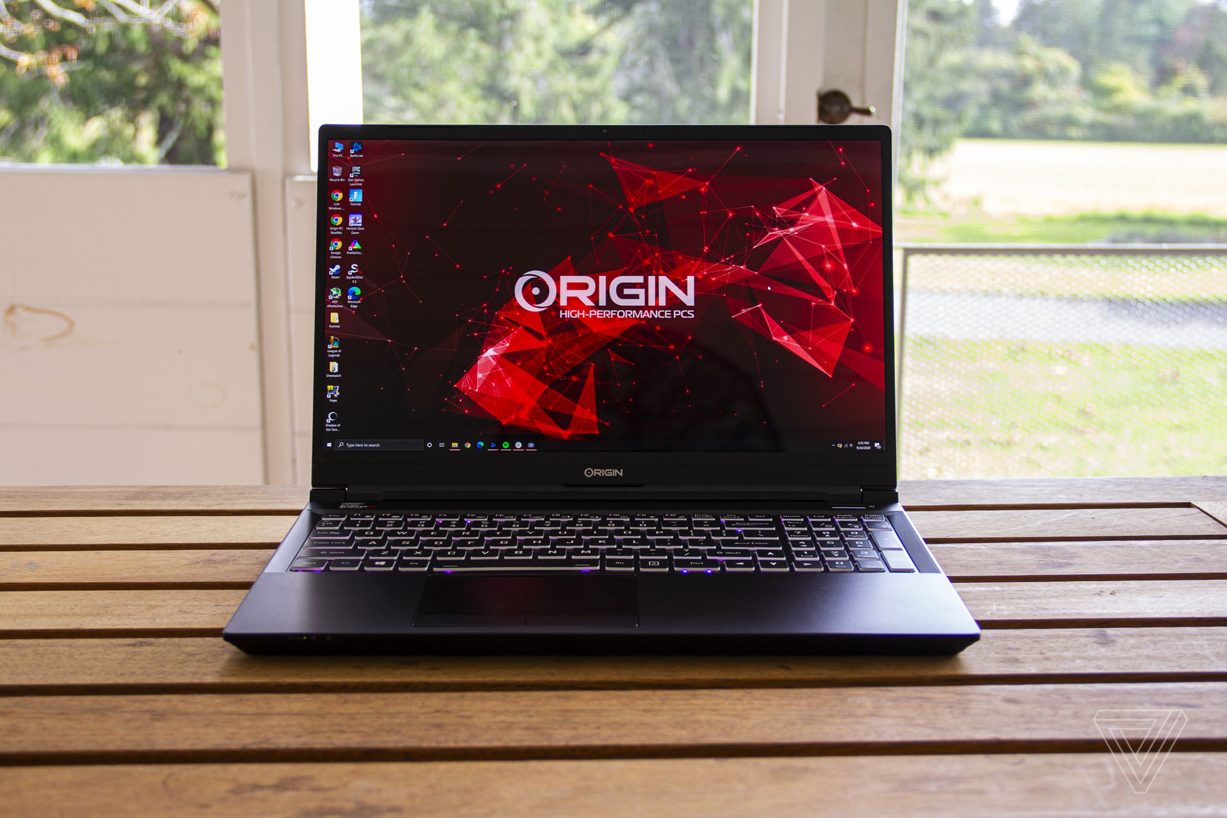 The Origin EVO15-S sits on a porch table.