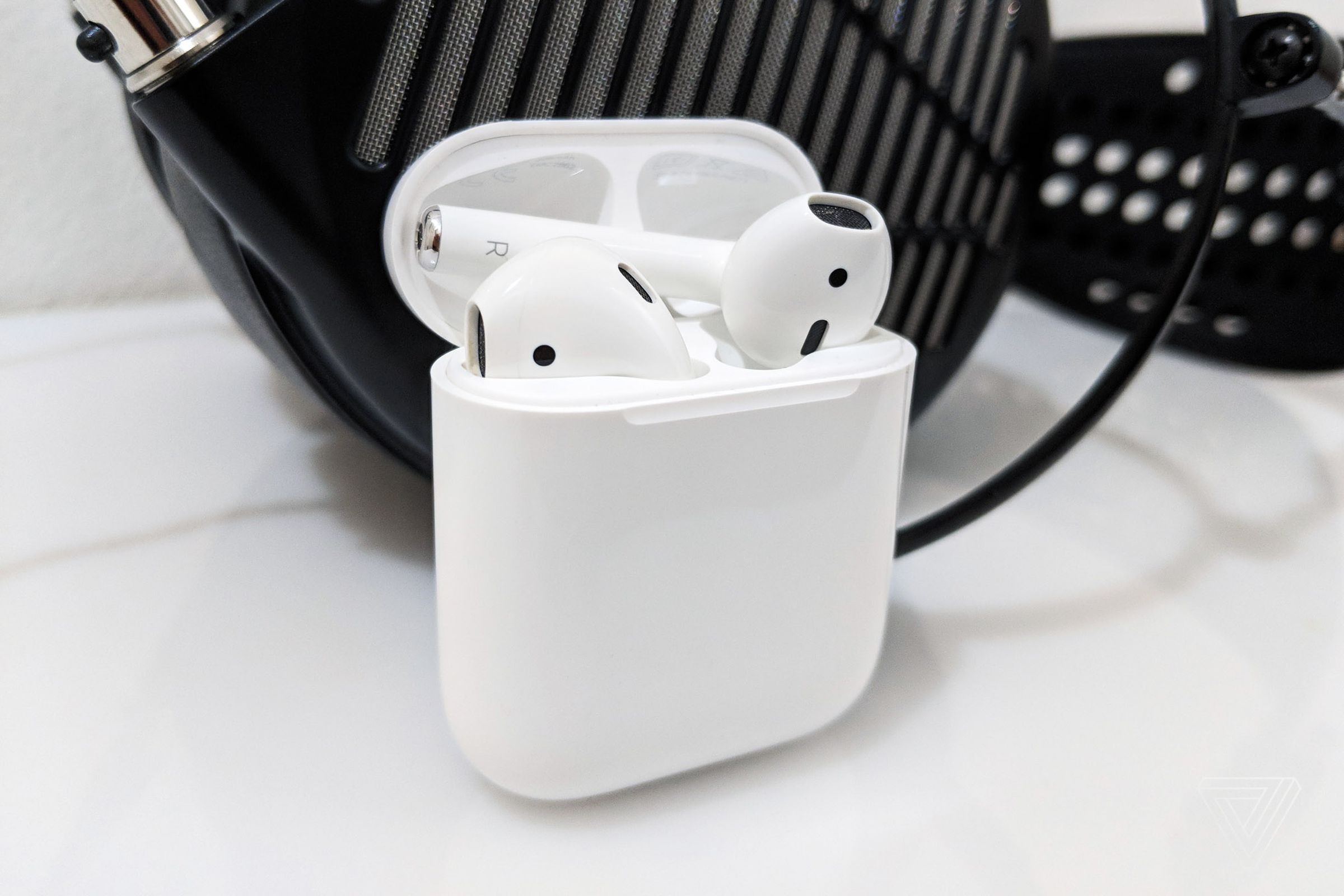 Apple AirPods in front of Audeze MX4