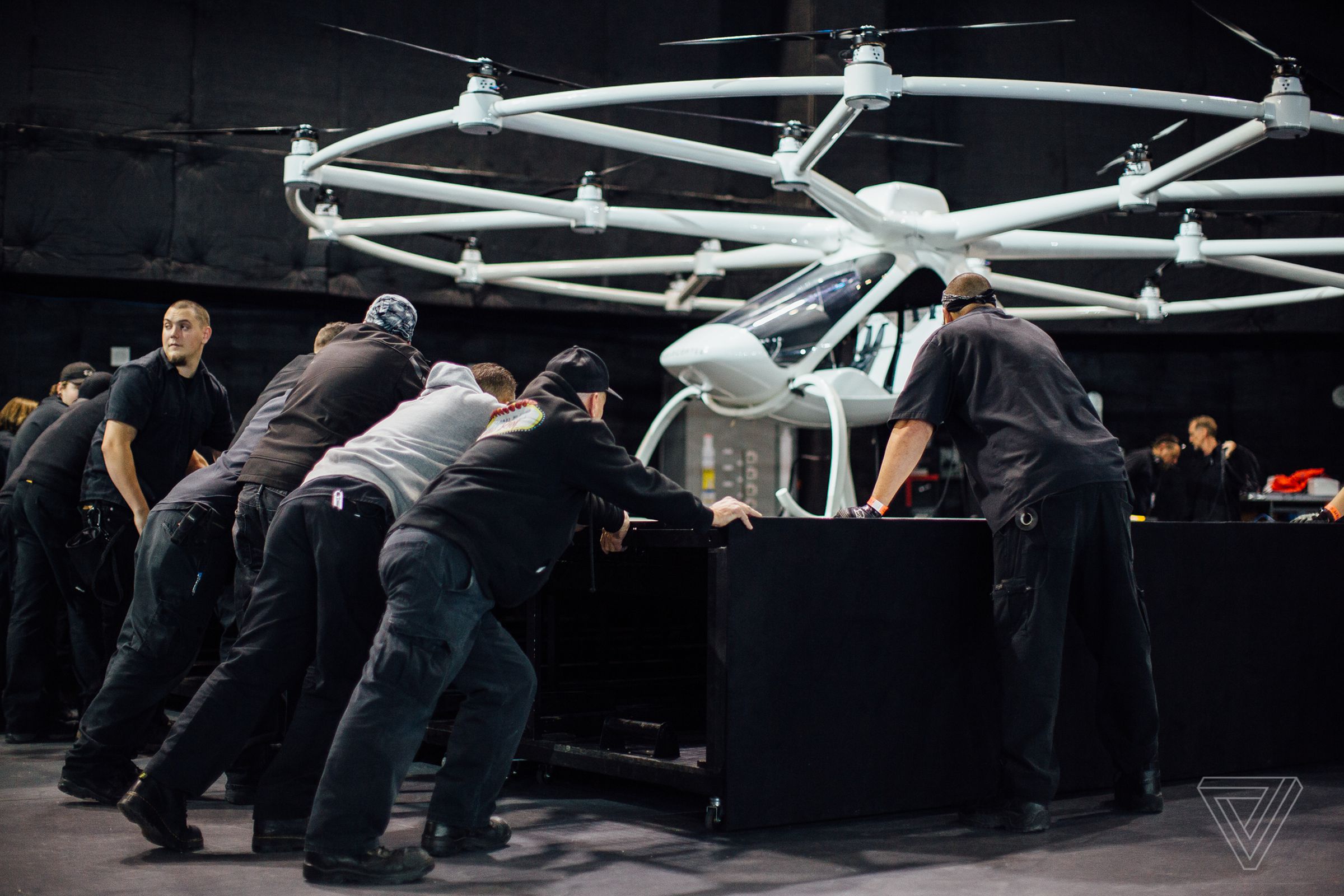 After rehearsal, workers reset the stage with the Volocopter.