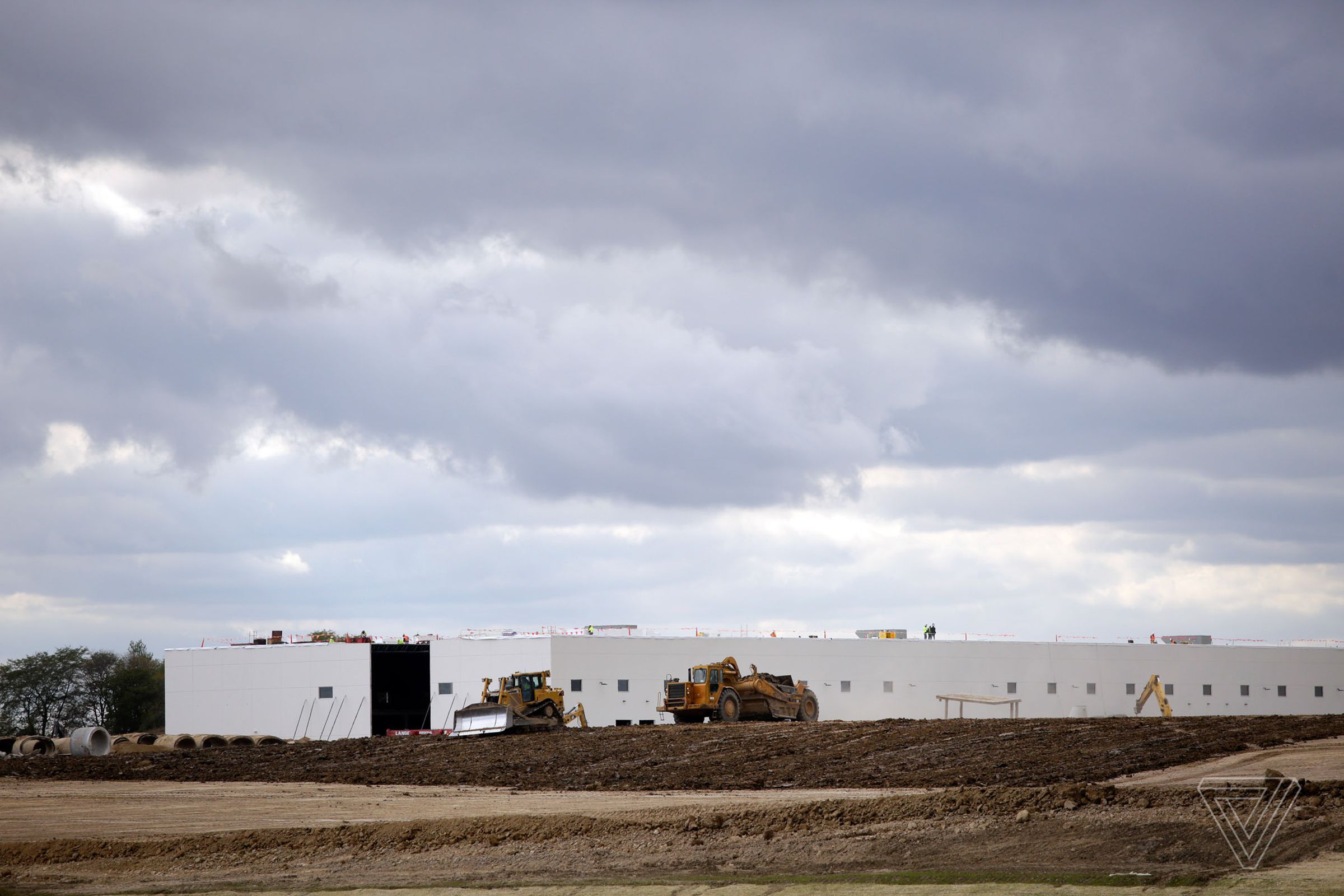 Workers drive their construction vehicles at the Foxconn construction site along 90th Street on Wednesday, October 25th, 2018, in Mount Pleasant, Wisconsin.