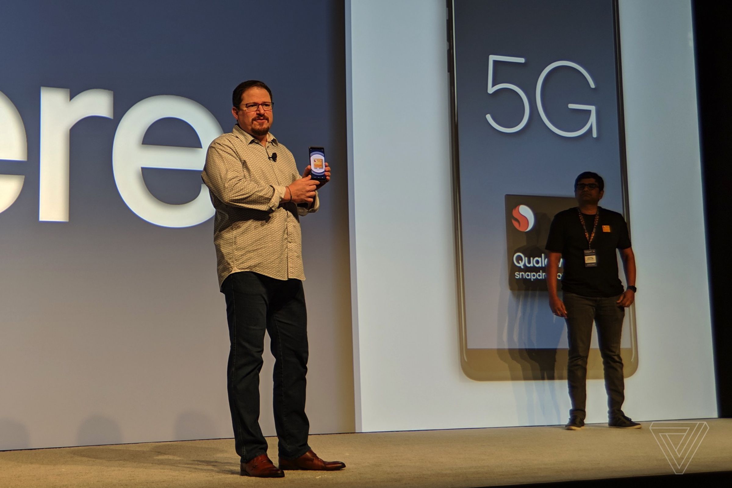 Qualcomm president Cristiano Amon holds the first Snapdragon 855 reference design smartphone.