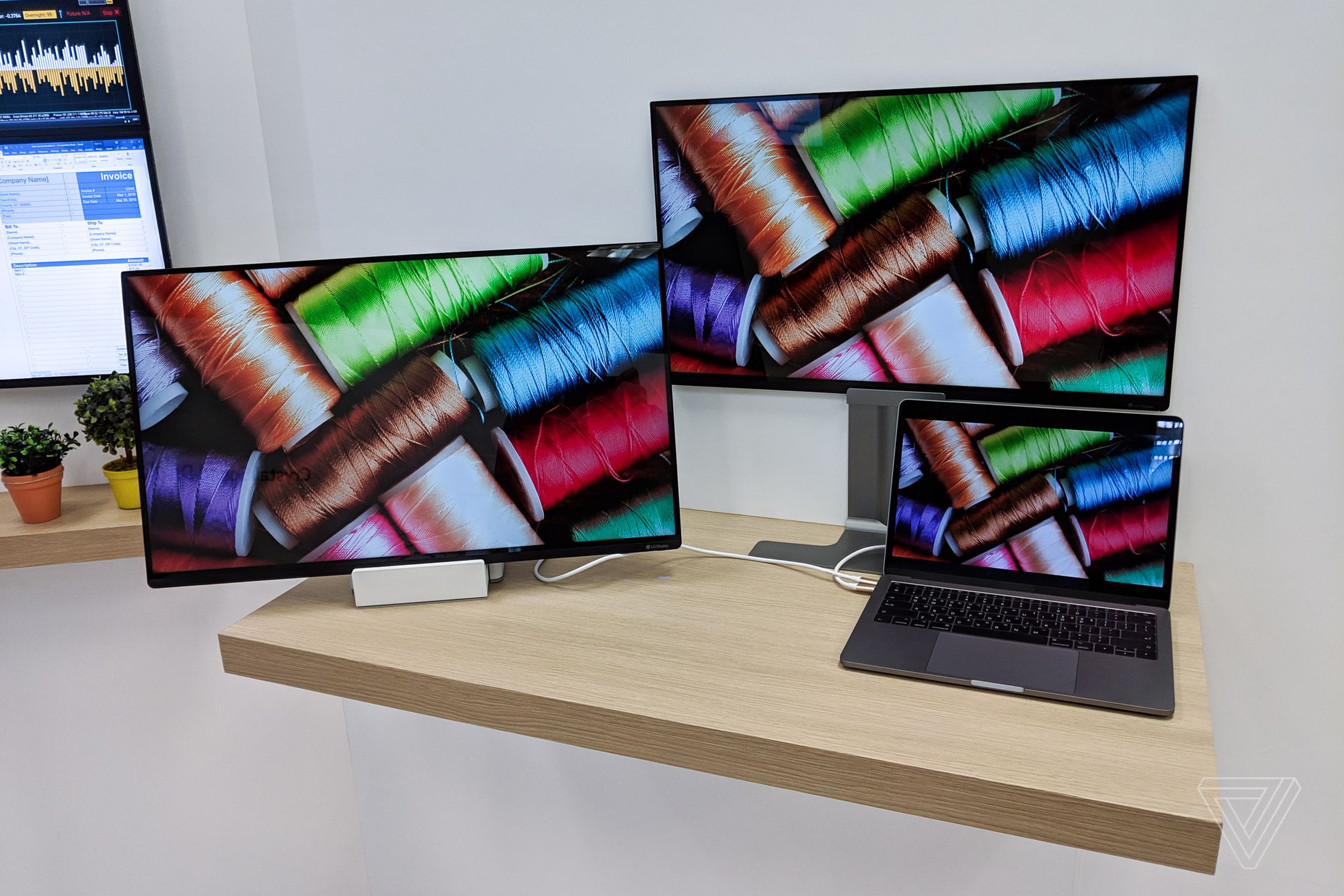 Two 27-inch LG Display Neo Art portable monitors driven off a single MacBook Pro.