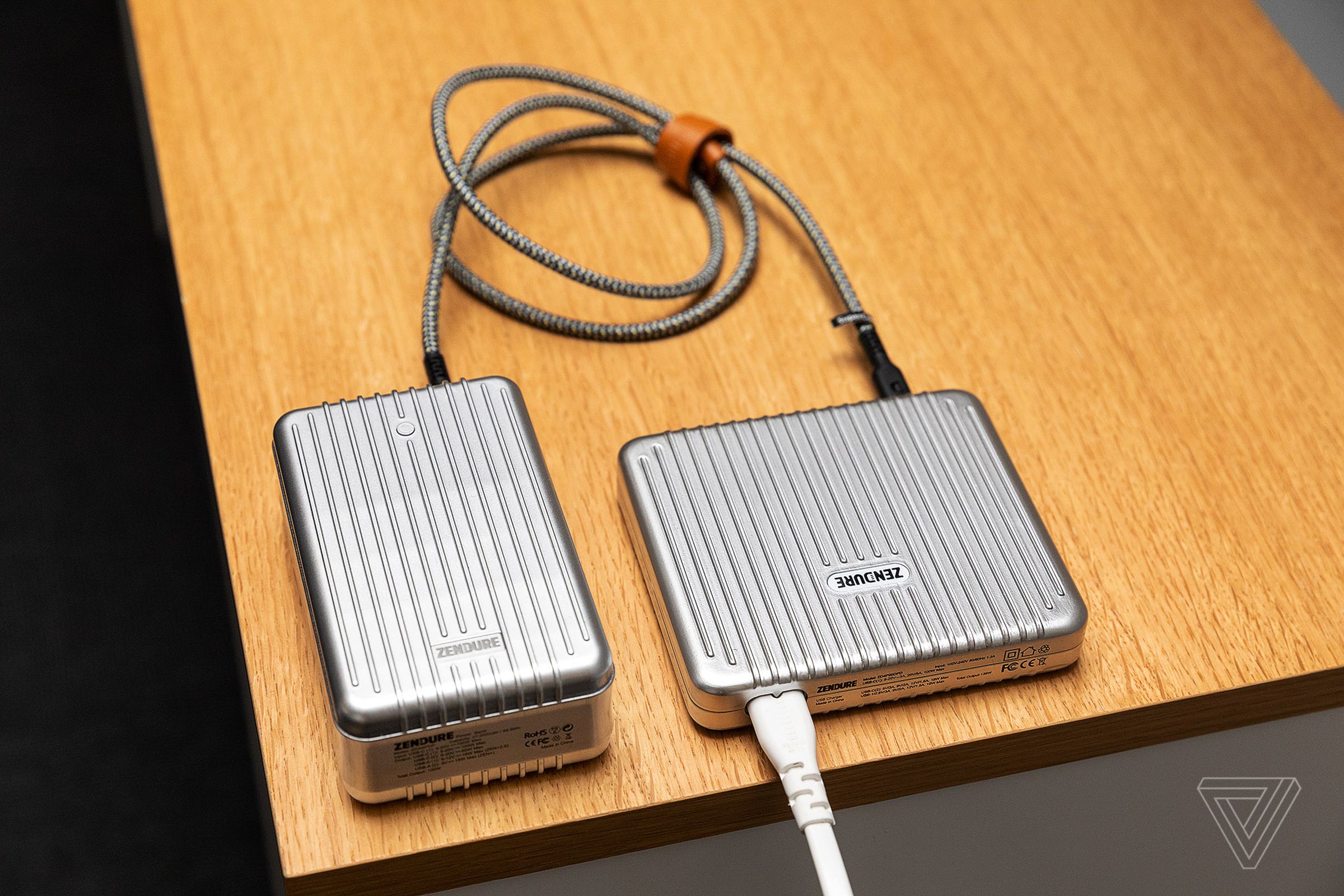 The SuperTank (left) next to the SuperPort wall charger.