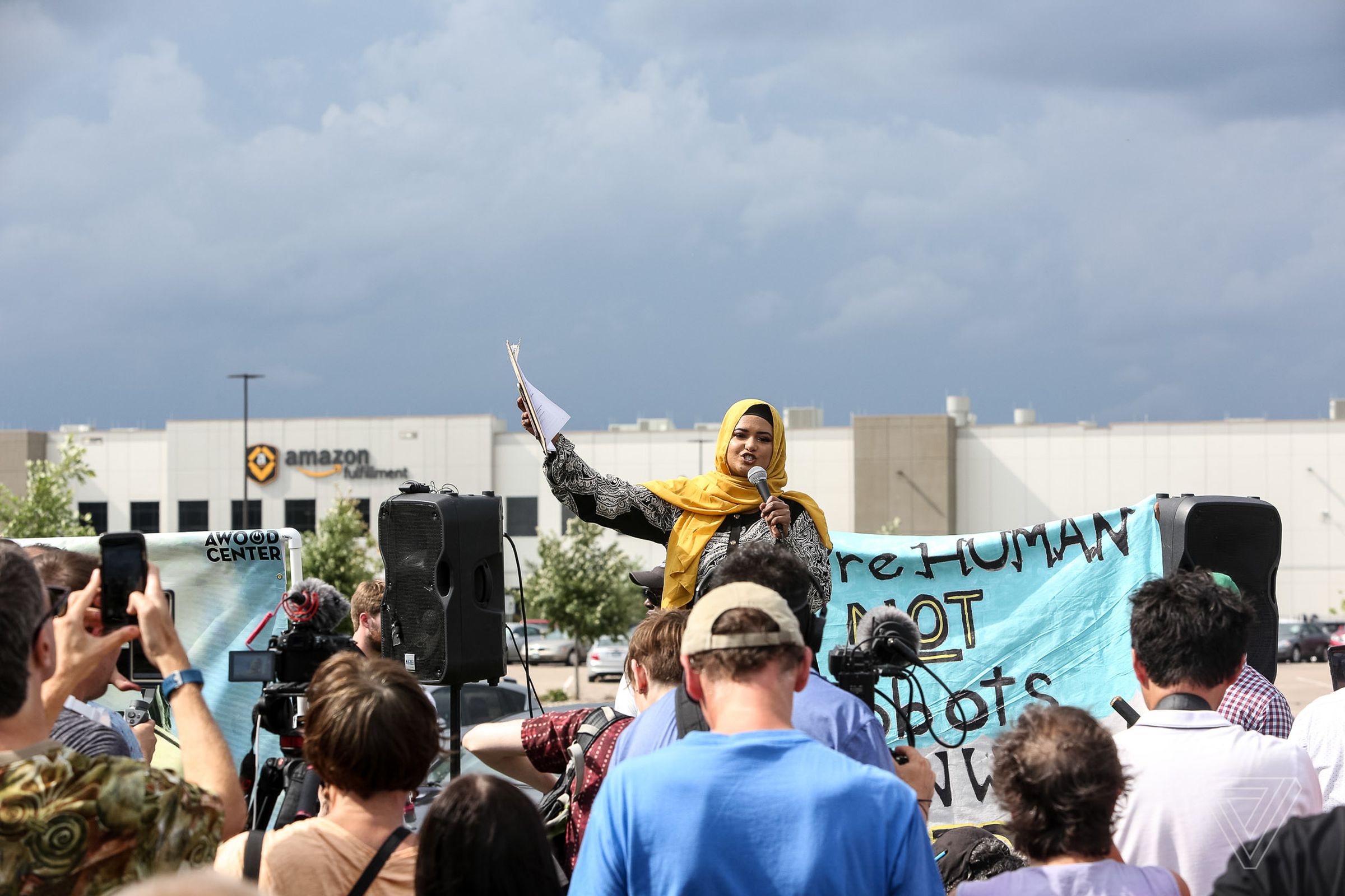 Sahro Sharif speaks during a rally and protest outside of the Amazon Fulfillment Center on Prime Day in Shakopee, Minn.
