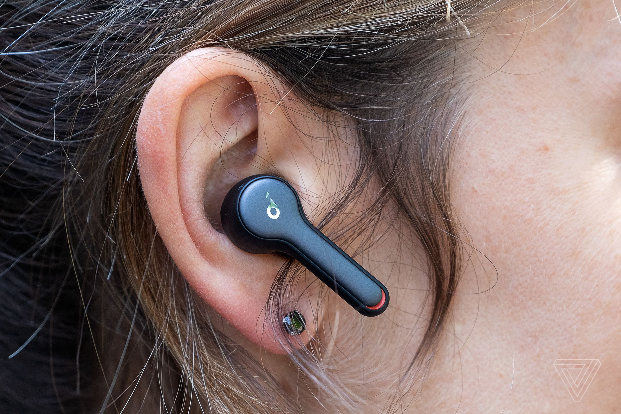 Anker’s Soundcore Liberty Air 2, pictured in a woman’s right ear, are the best cheap wireless earbuds for making voice calls.