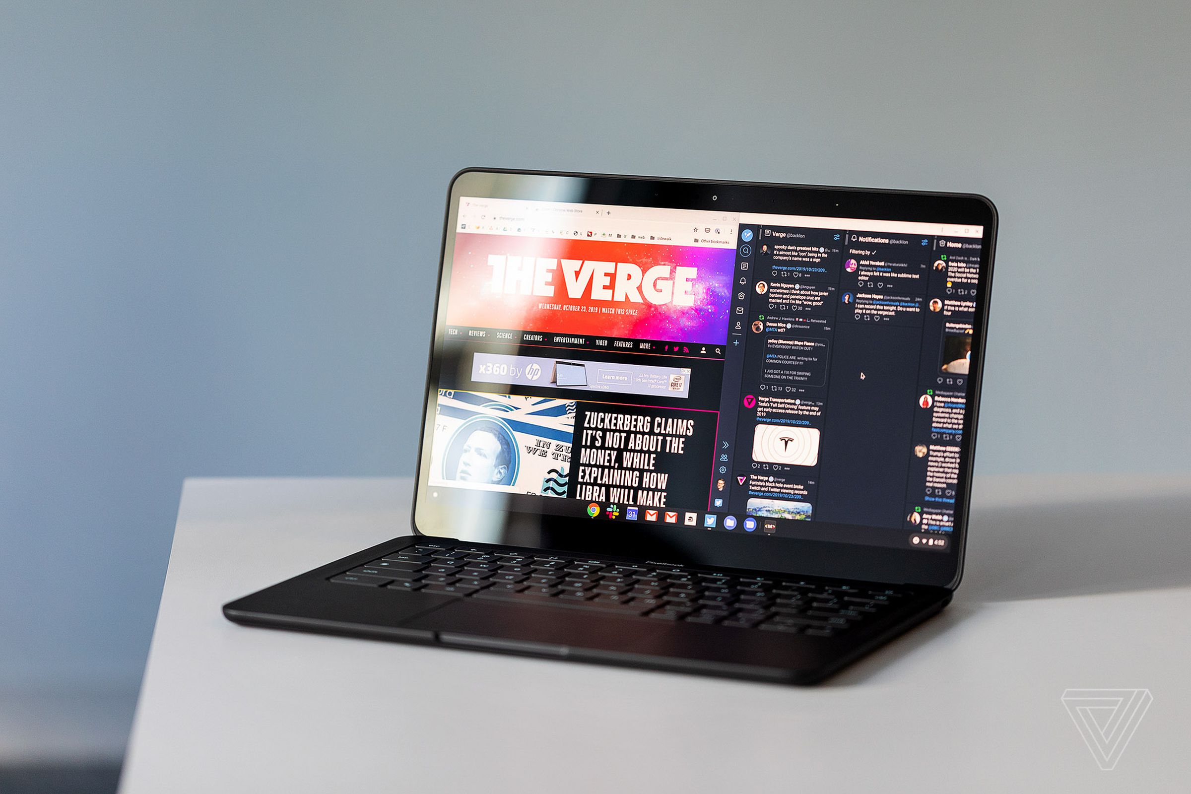 A black Pixelbook Go laptop sitting on a desk.