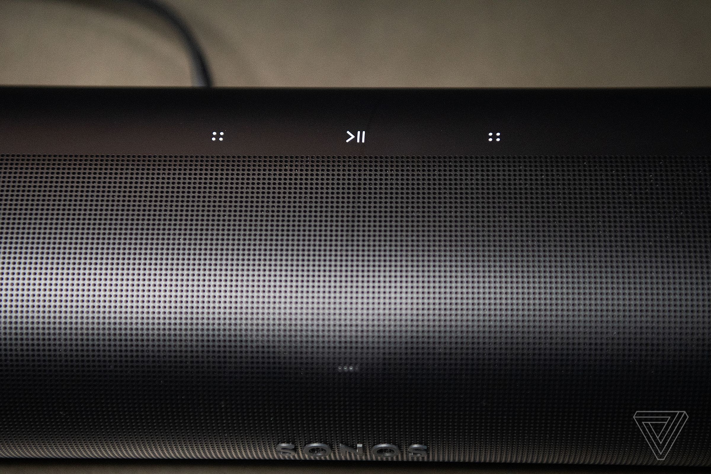 An overhead view of the capacitive buttons at the top of the Sonos Arc.