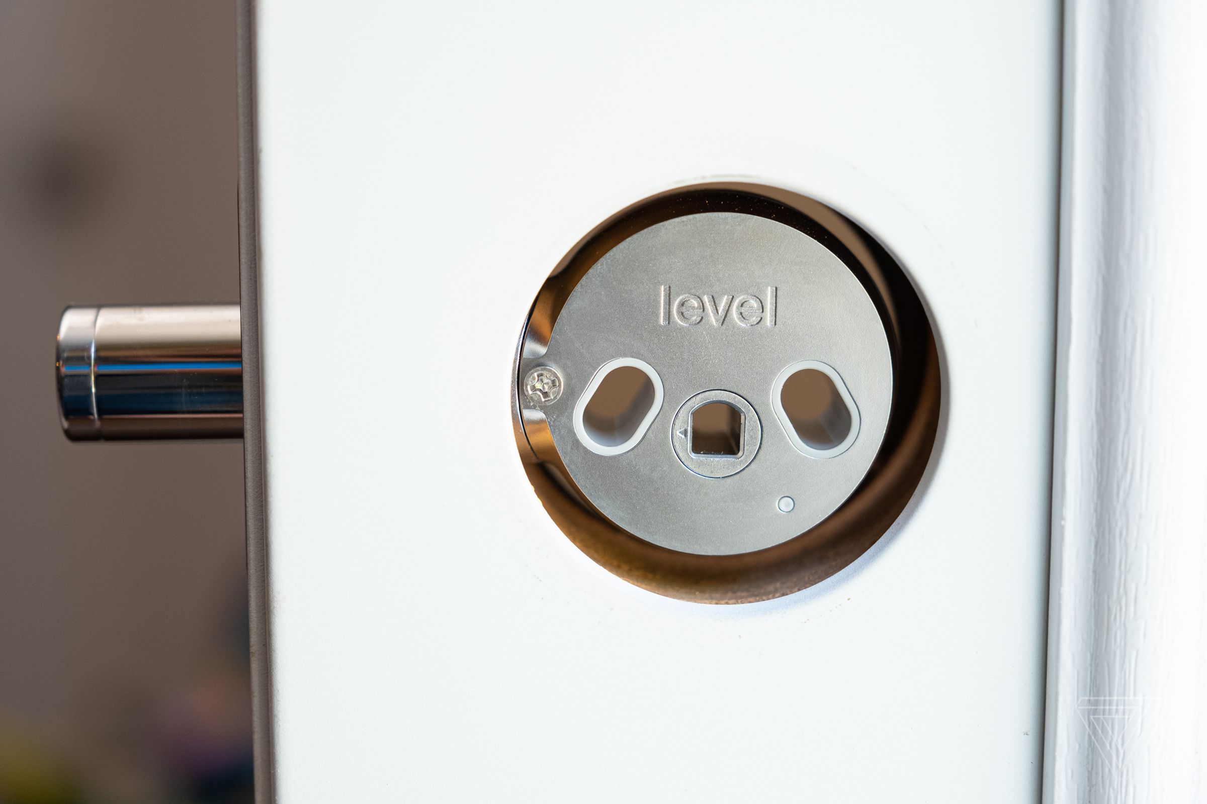 The Level Lock smart lock in a door frame