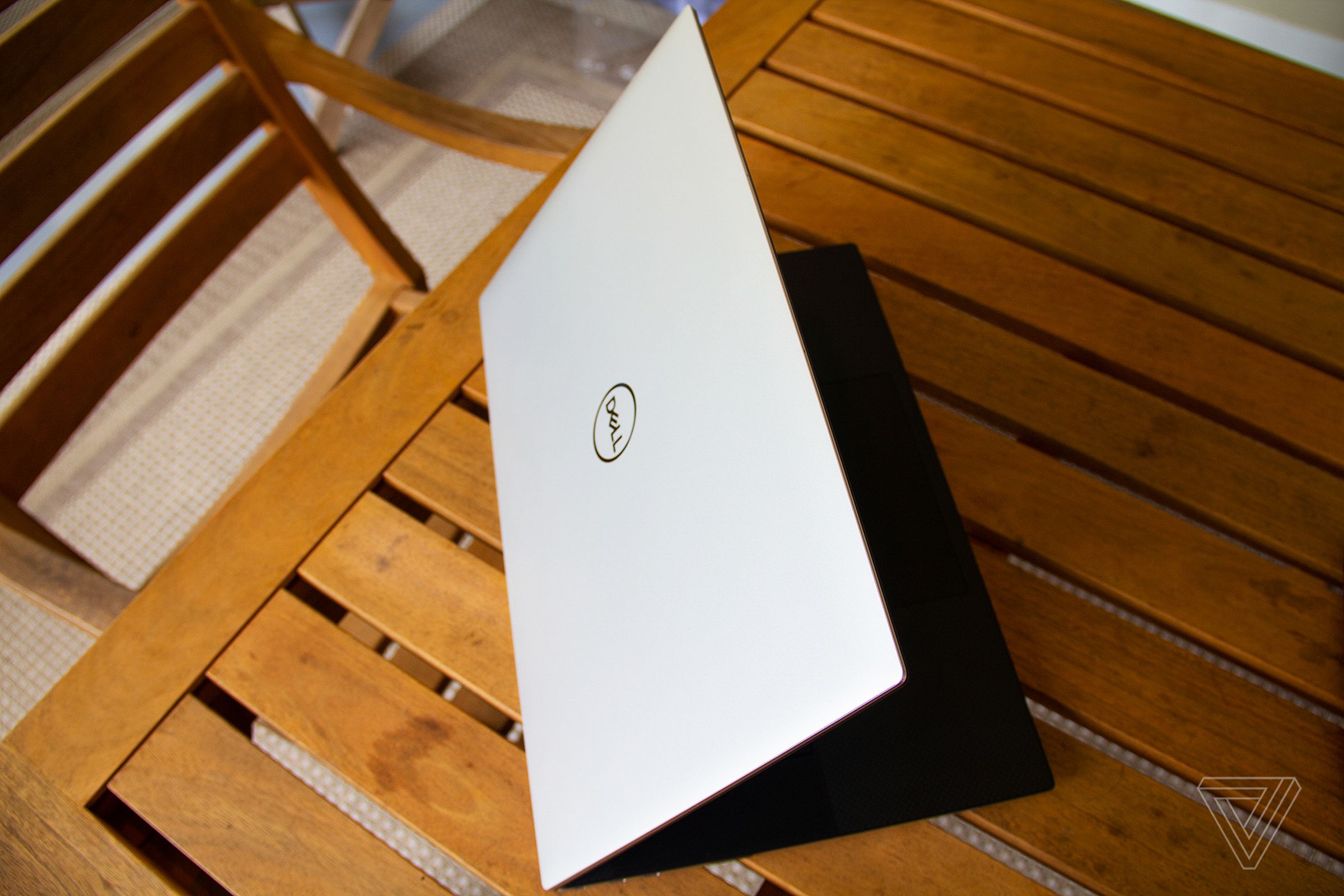 The Dell XPS 17 on a table halfway open, from above.