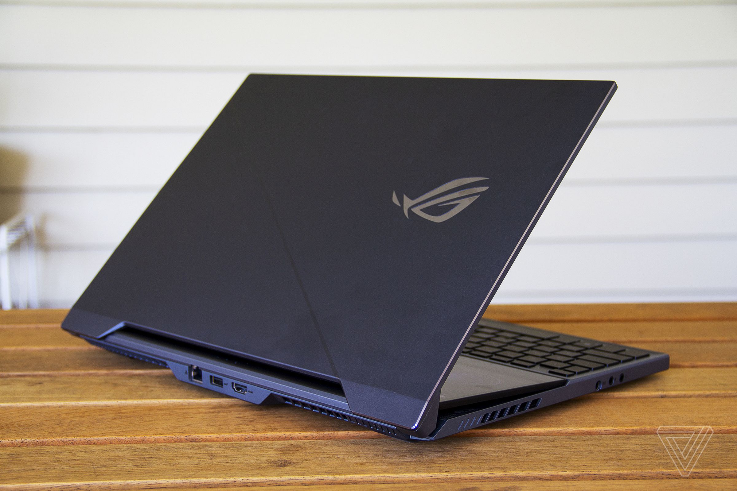 The Asus ROG Zephyrus Duo 15 half open from the back.