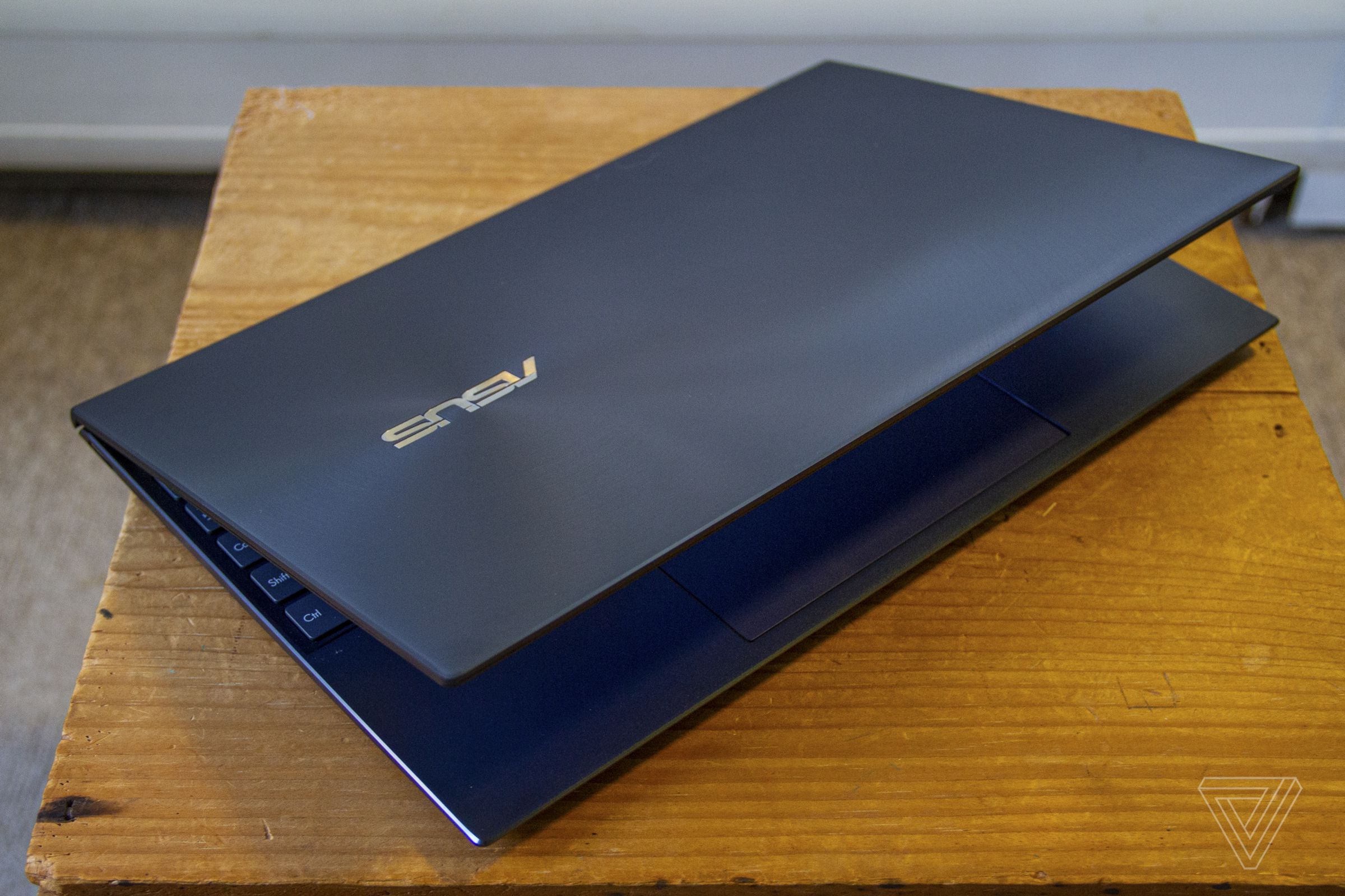 The Asus Zenbook 14 half closed from above.