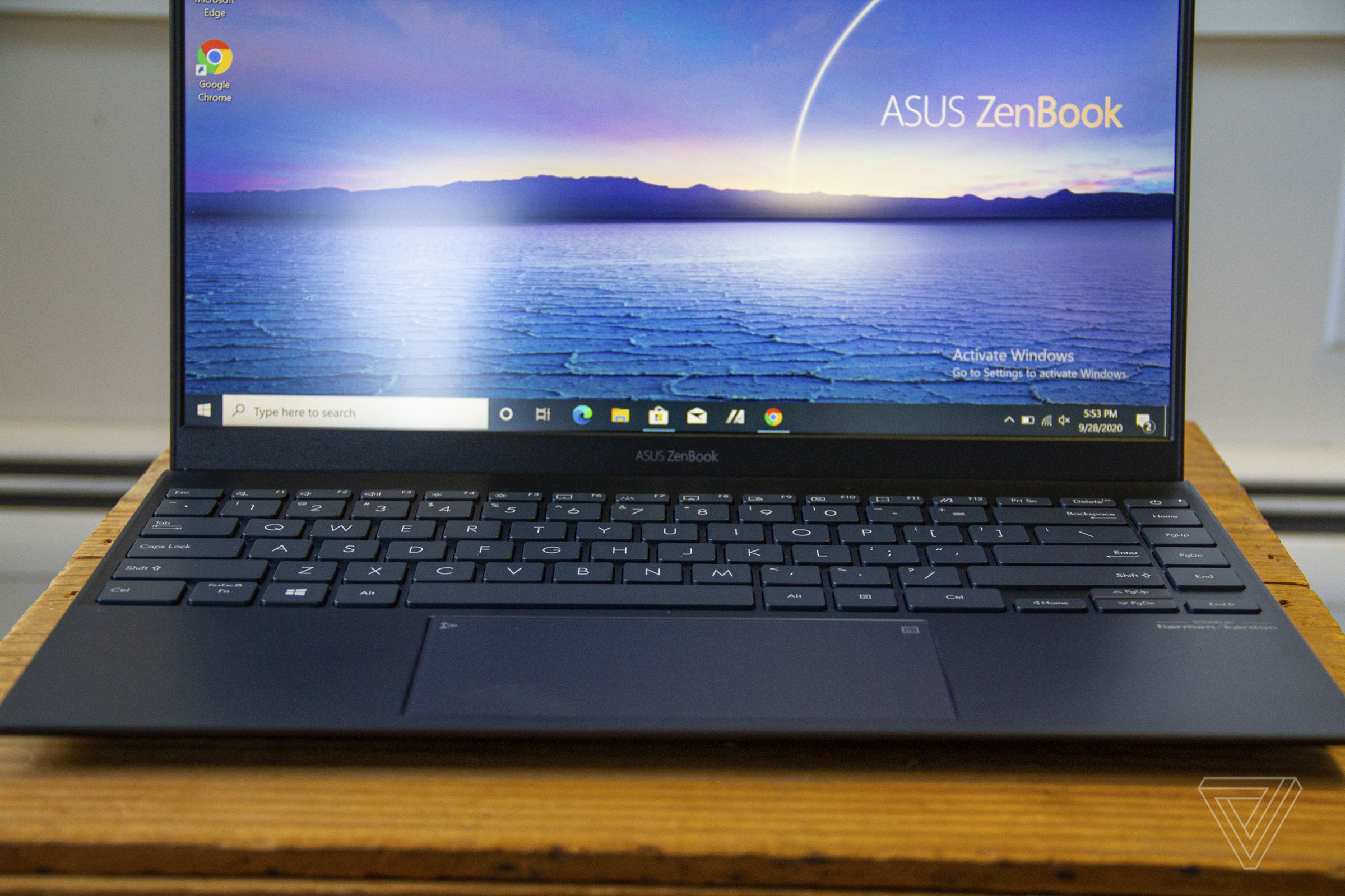 The Asus logo on the bottom bezel of the Asus Zenbook 14.