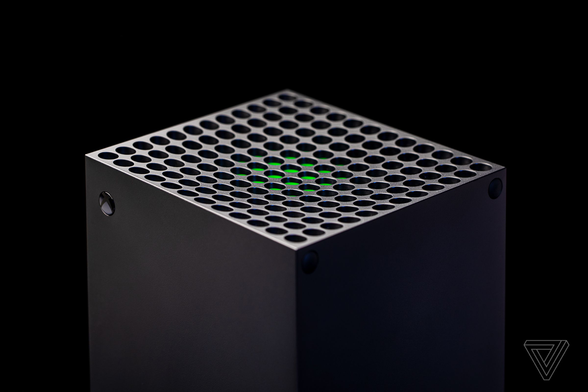 The upper part of the Xbox Series X placed against a black background.