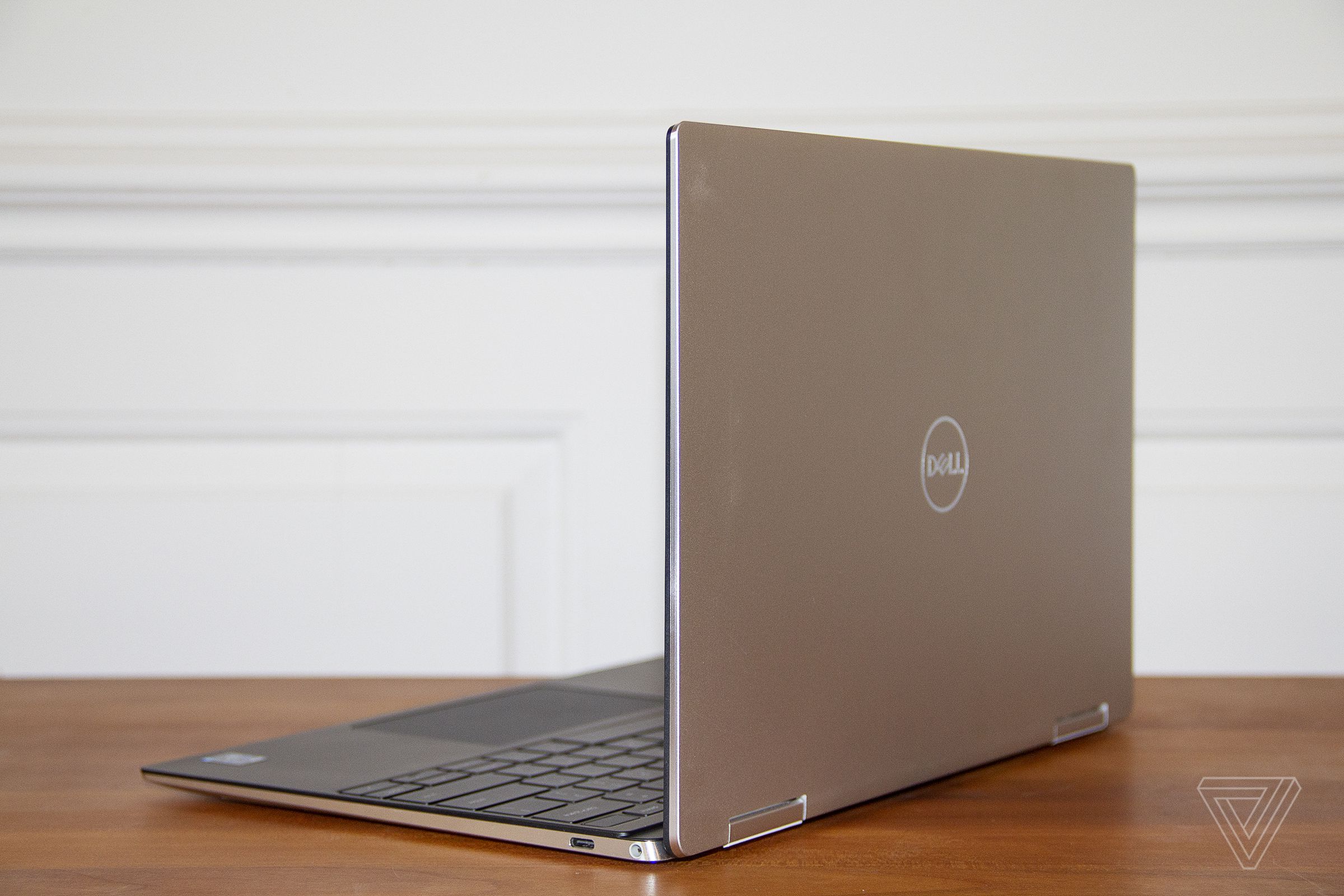 The Dell XPS 13 2-in-1 from the back, angled to the left.