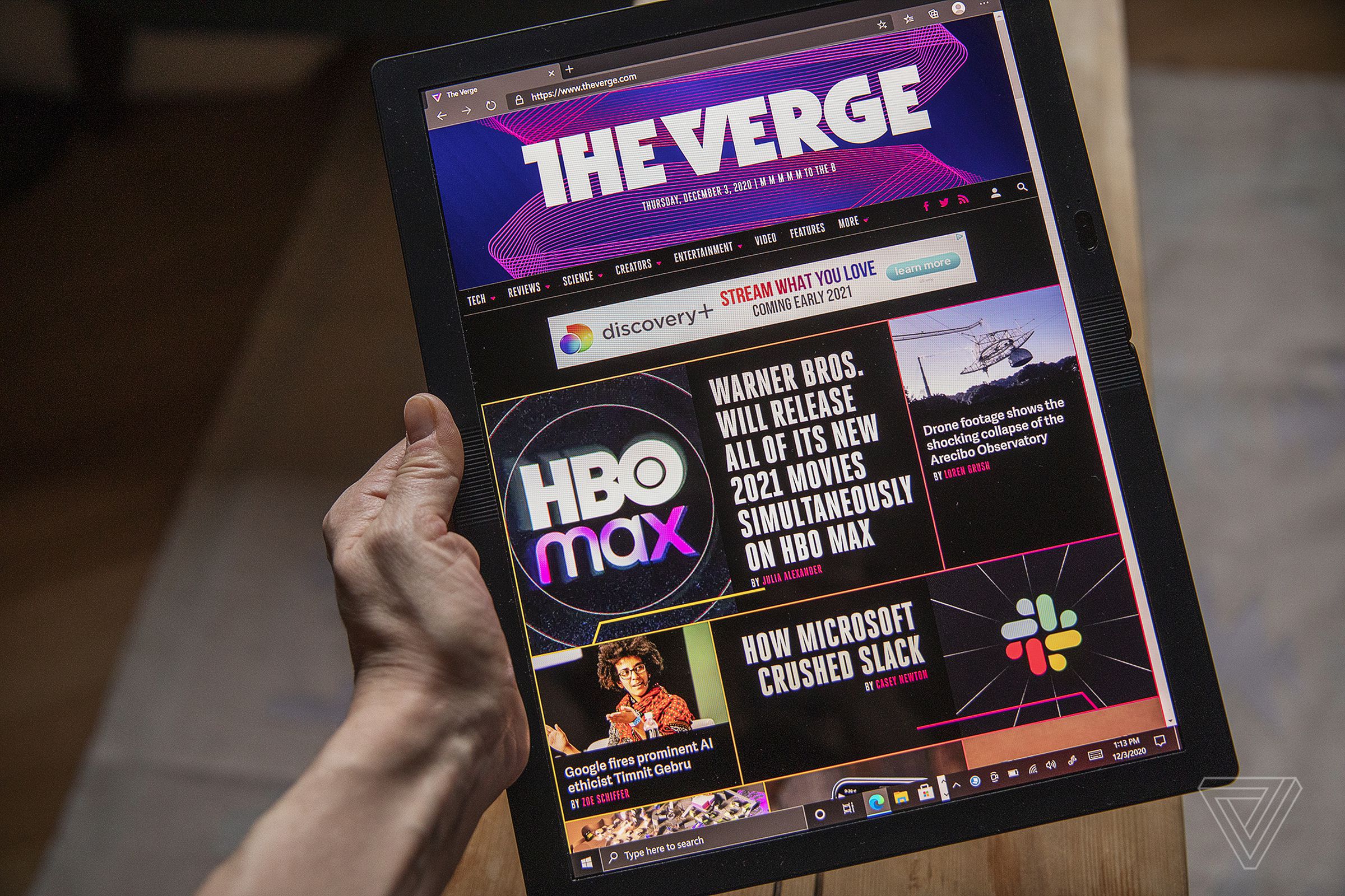 The Lenovo ThinkPad X1 Fold in tablet mode, displaying The Verge’s homepage.
