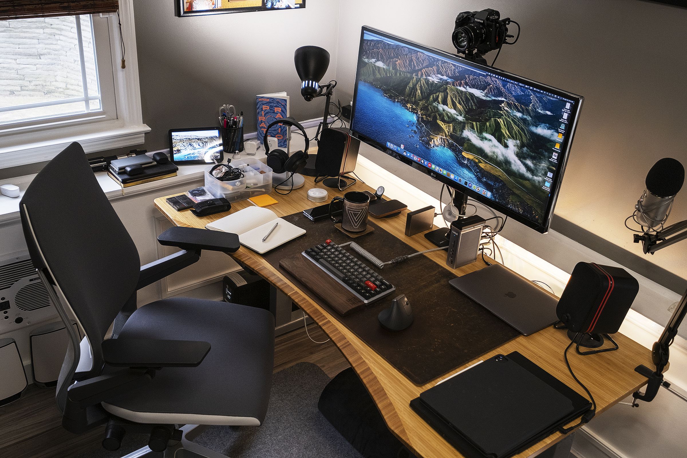 Dan’s desk is large enough to have space for multiple devices at the same time.