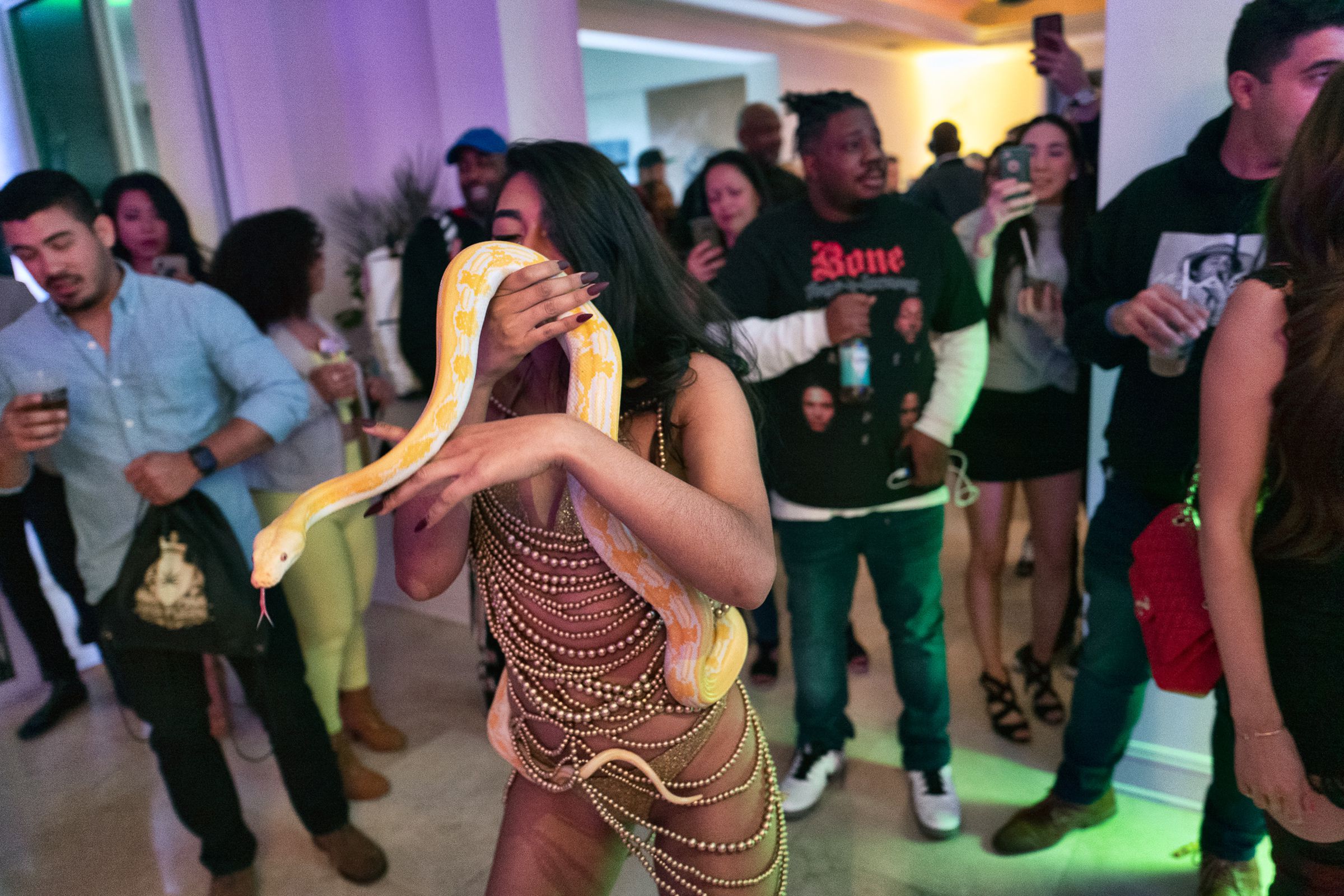A party at the house involved women carrying around snakes.