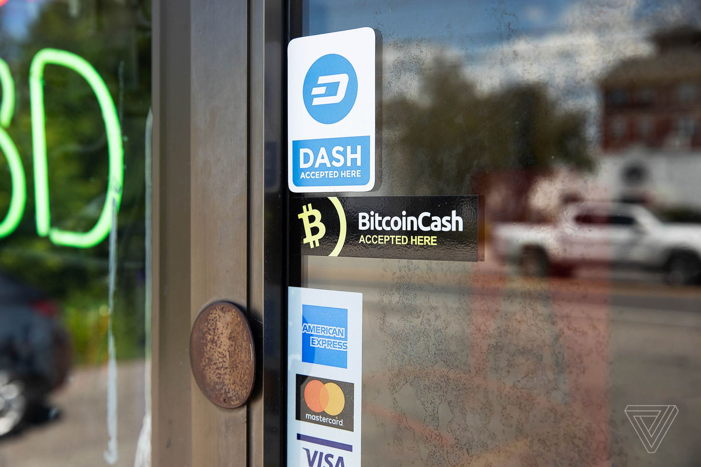 A Bitcoin Cash sticker remains on the door to the Campus Convenience store.