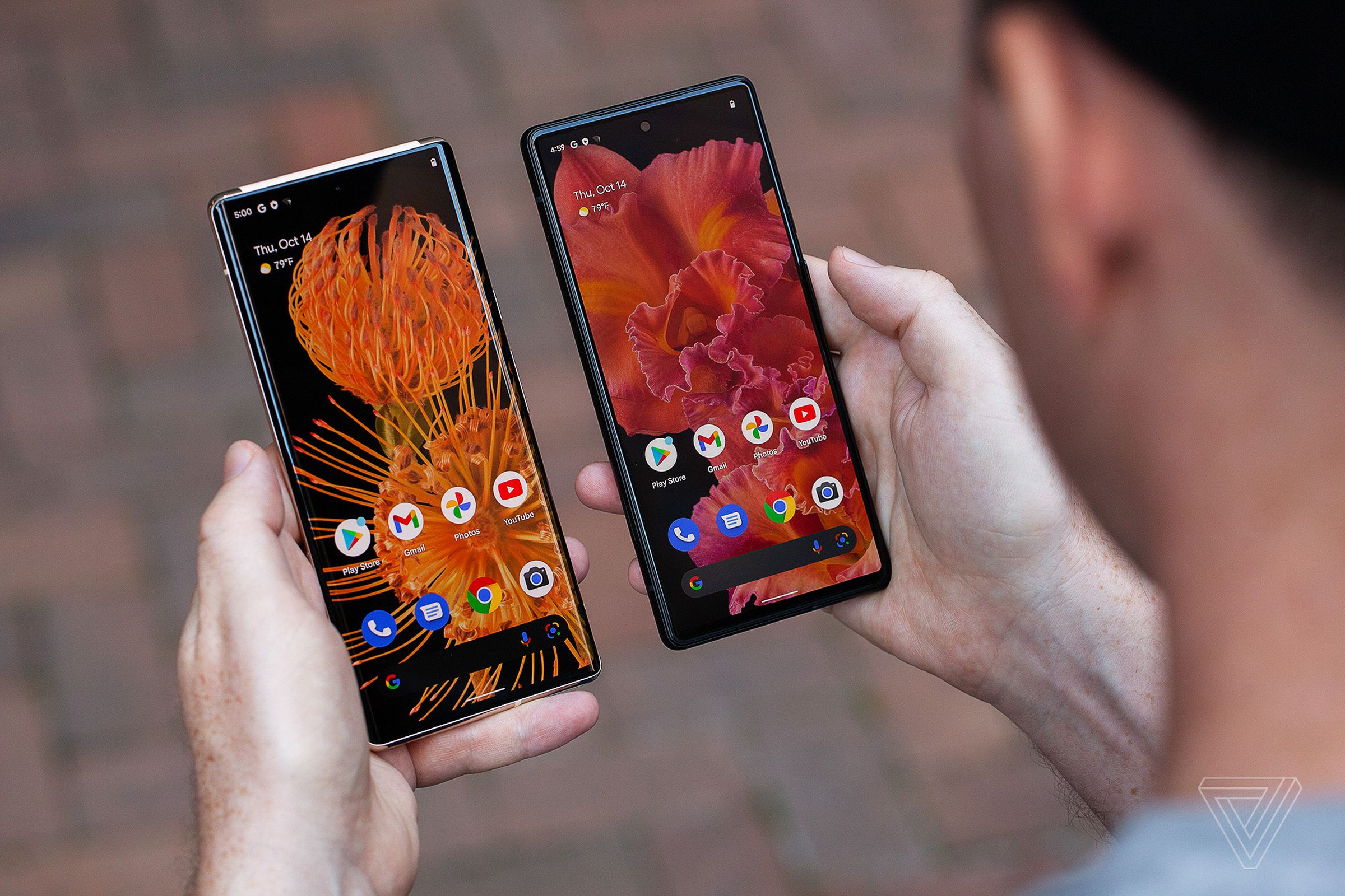 An image of Google’s Pixel 6 Pro and Pixel 6 being held in a person’s left and right hands.