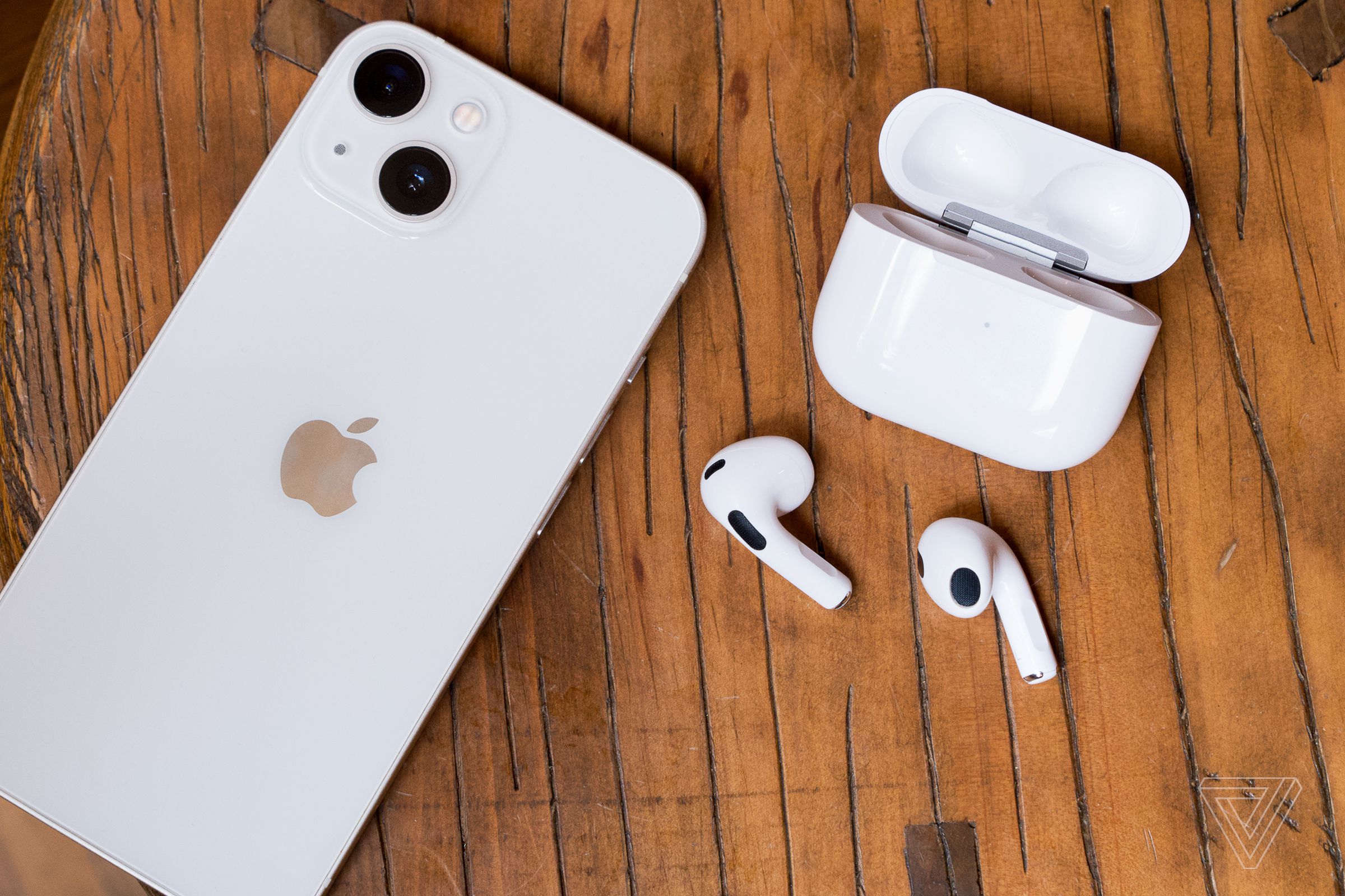 An iPhone and pair of third-gen AirPods.