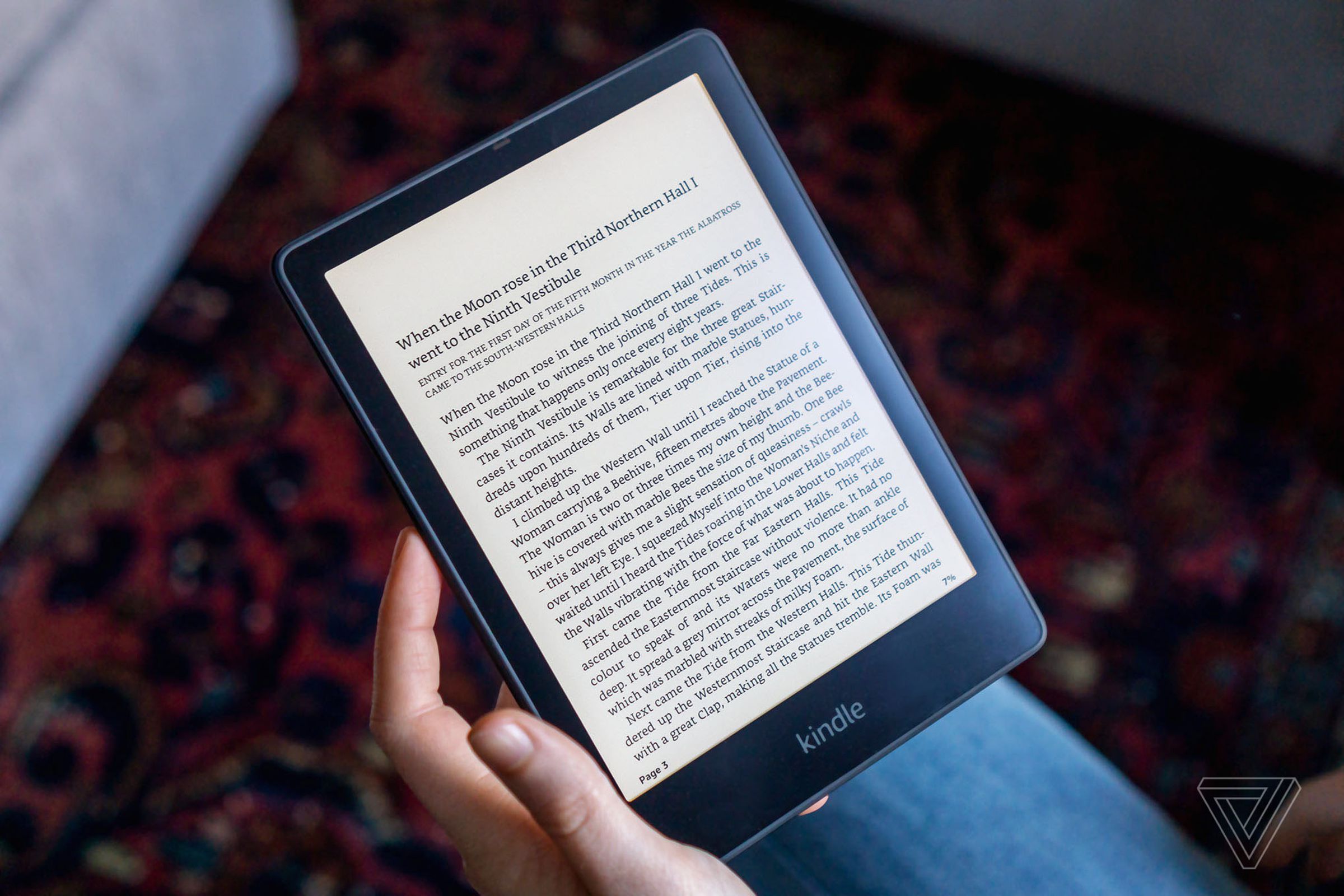 A person holding a Kindle Paperwhite