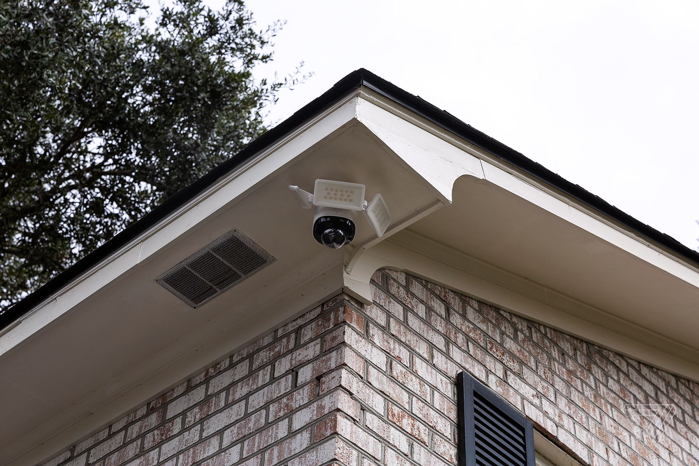 The Eufy Floodlight Cam 2 Pro looks like a mall security camera hanging off your house. It only works under eaves (as pictured), not mounted on a wall.