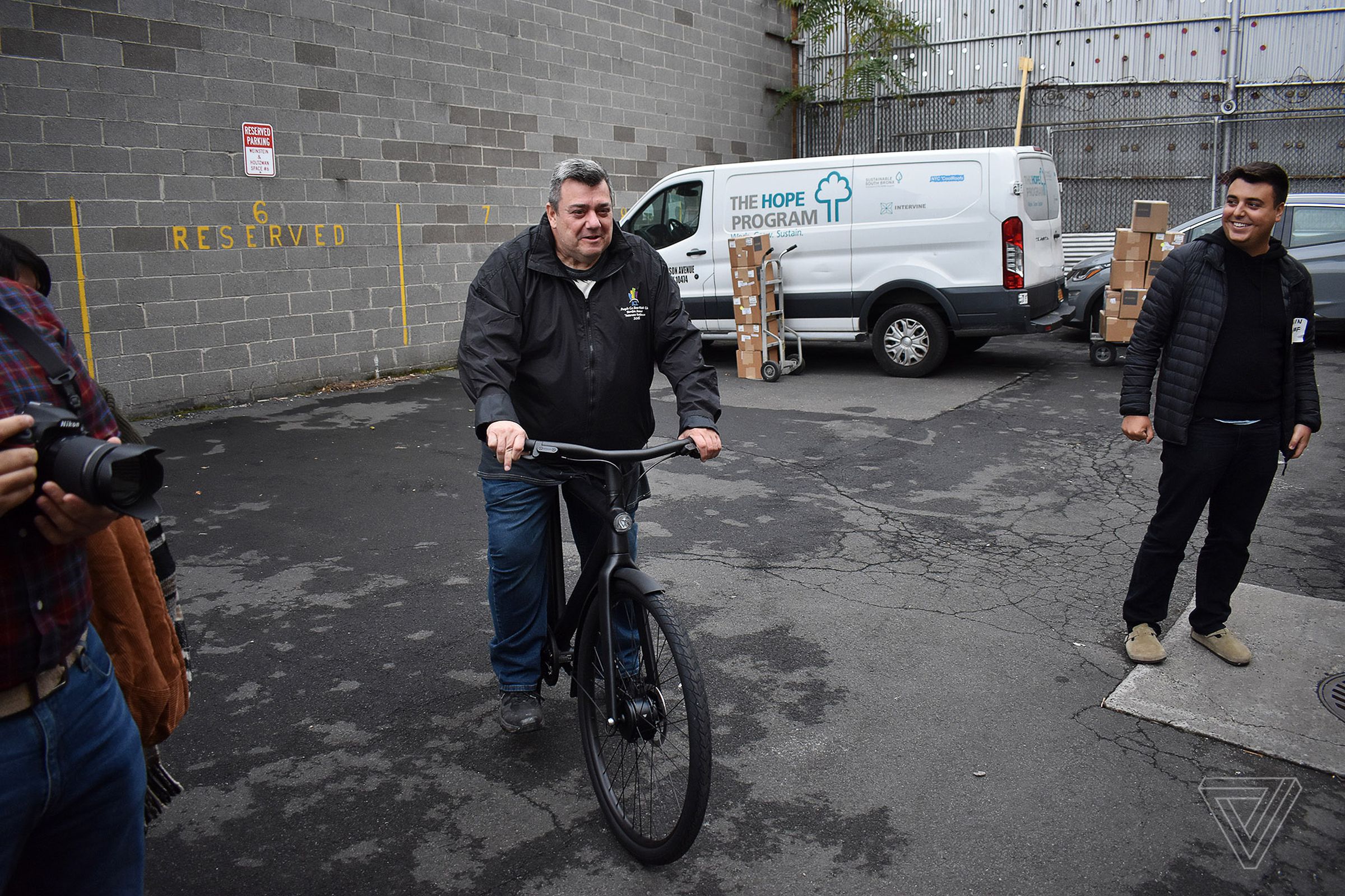 Michael Scanlon, a driver from the Bronx, tries out his new VanMoof e-bike.
