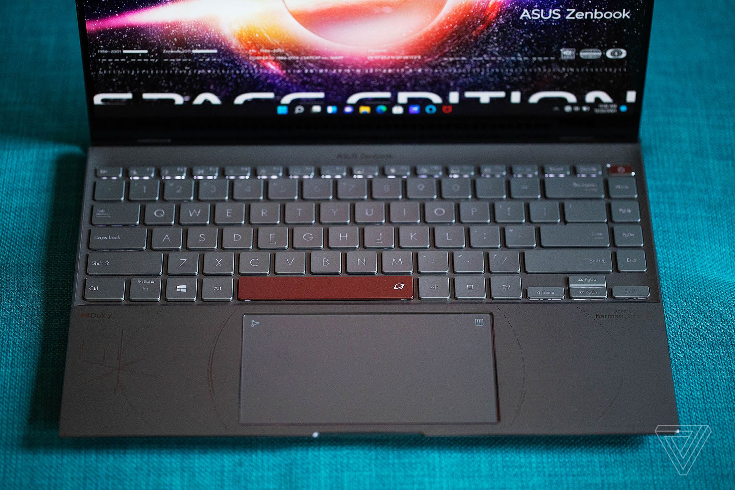 The Asus Zenbook 14 OLED Space Edition keyboard seen from above. The screen displays the words Space Edition.