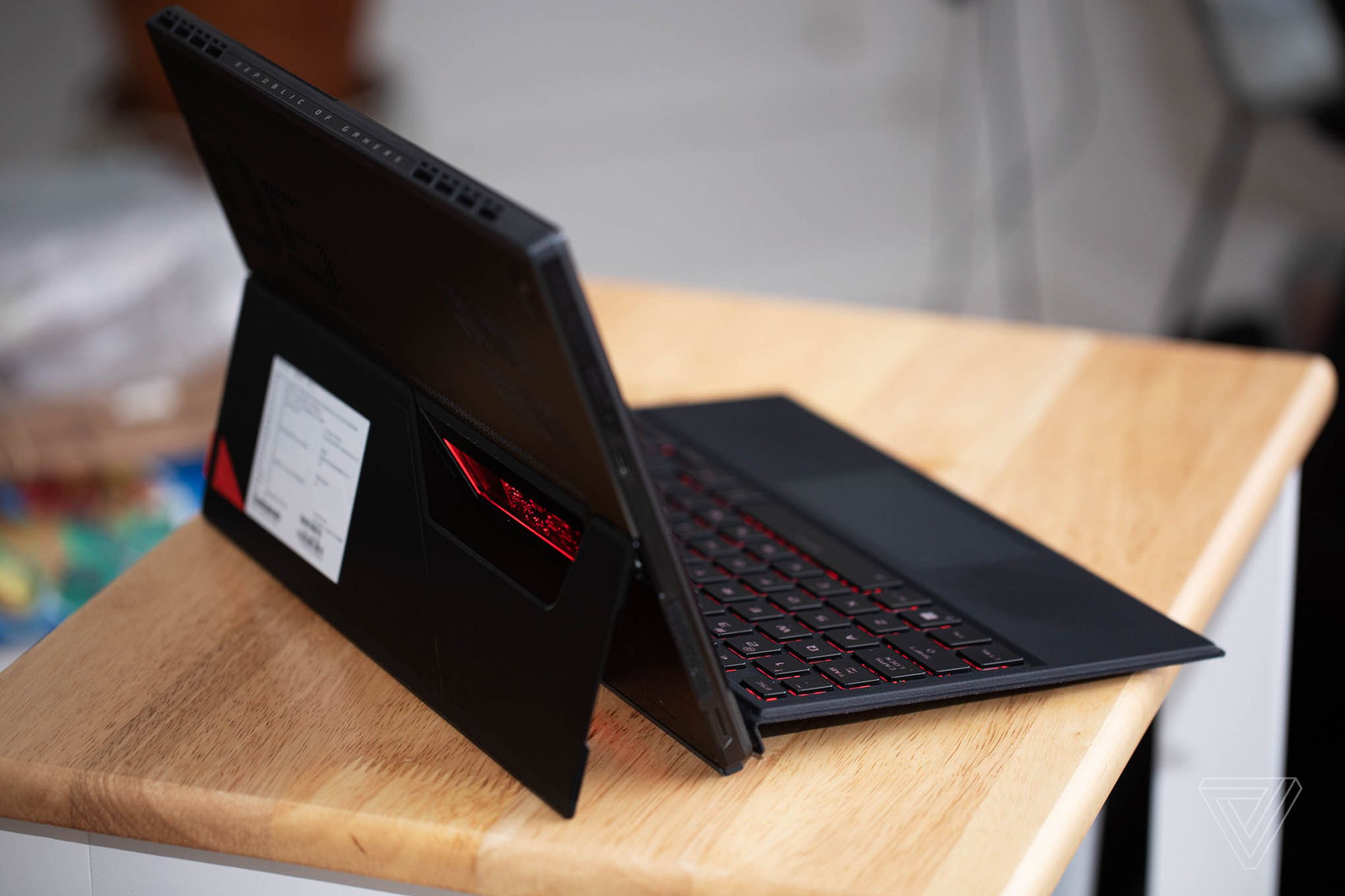 The Asus ROG Flow Z13 in laptop mode seen from the back with the kickstand out.
