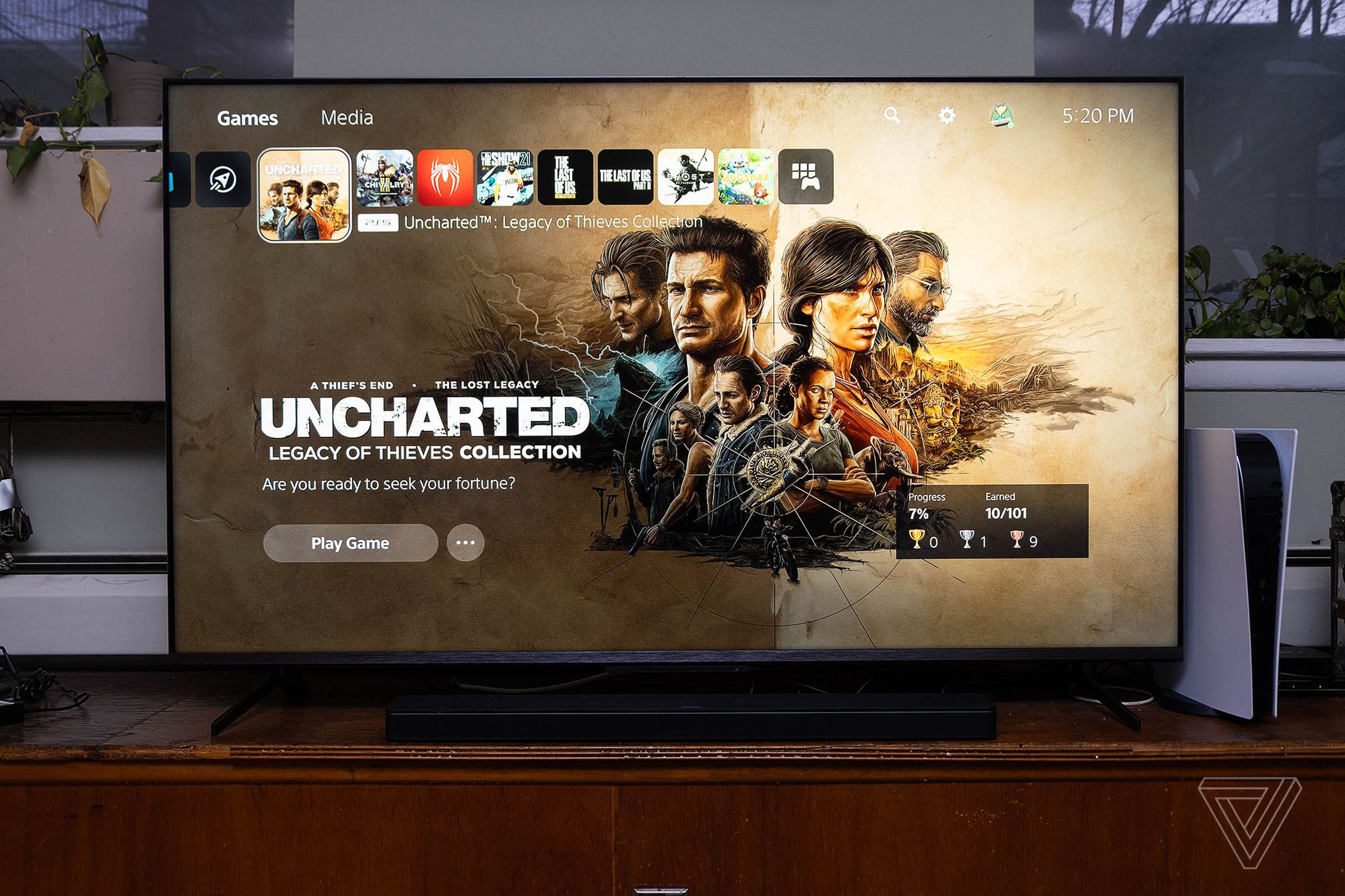 TCL’s 6-series TV displaying the PS5 home menu screen, with Uncharted Legacy of Thieves Collection showing.
