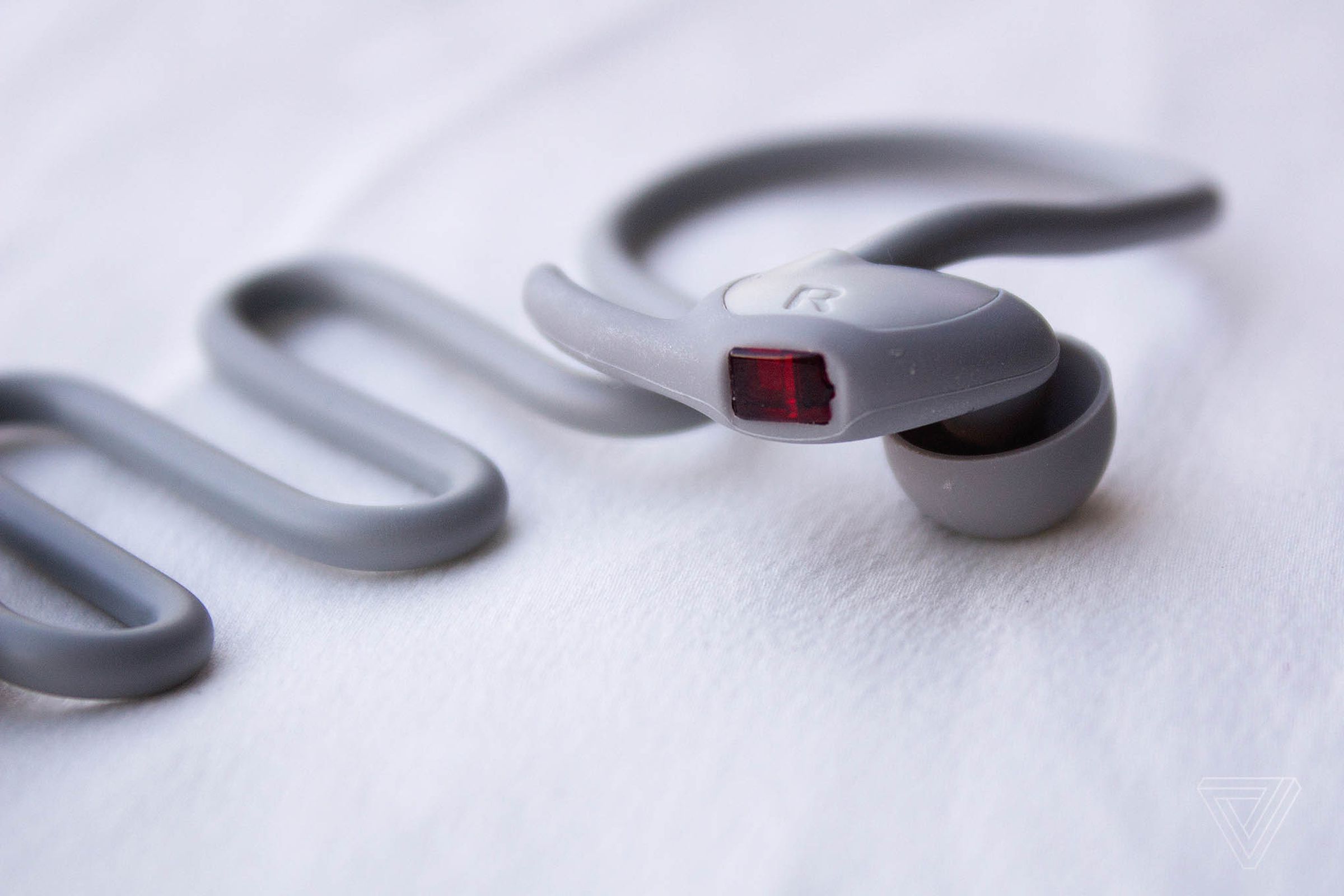 The optical heart rate sensor is located in the right earbud.